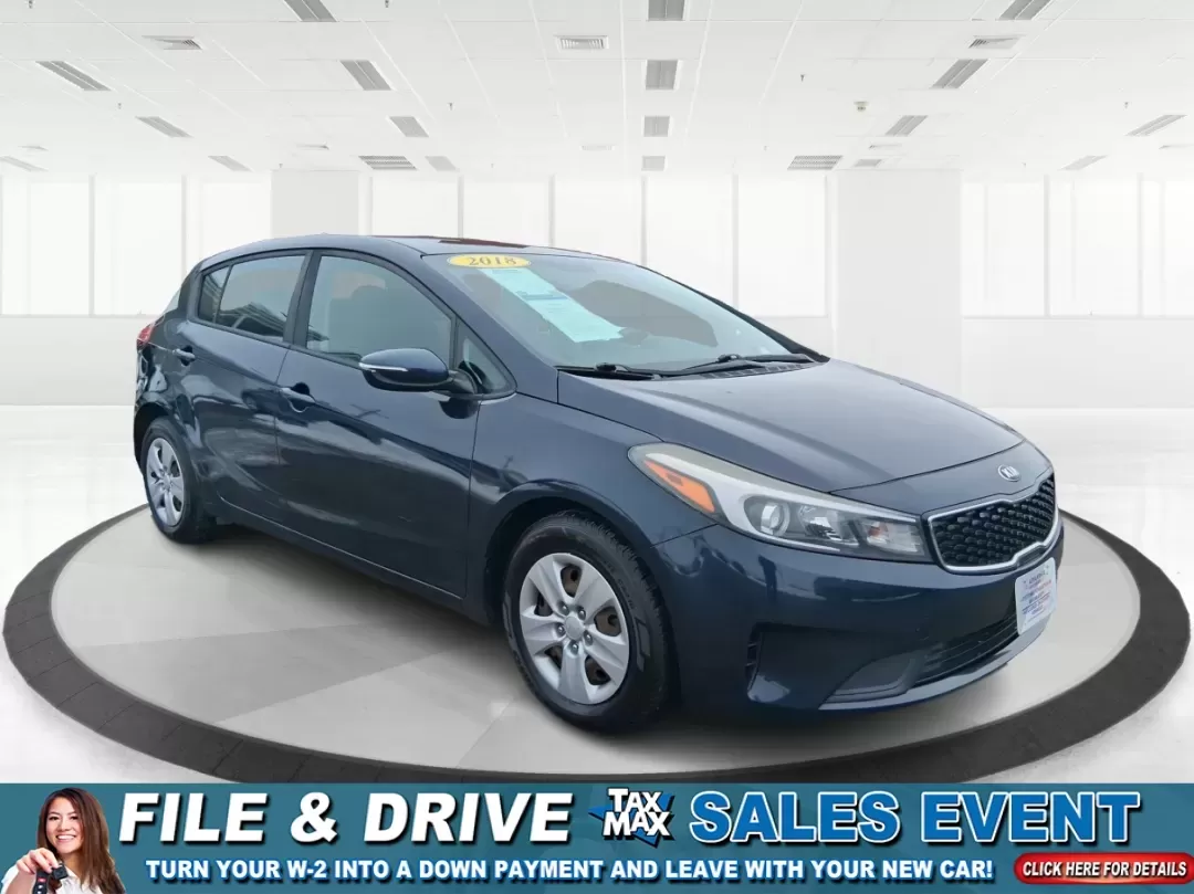 2018 Kia Forte LX (KNAFK5A89J5) with an 2L I-4 DOHC engine, 6A transmission, located at 1951 S Dayton Lakeview Rd., New Carlisle, OH, 45344, (937) 908-9800, 39.890999, -84.050255 - Need a smart, budget-friendly ride that can handle daily commutes to Dayton, quick grocery runs, and spontaneous weekend trips without feeling cramped? This 2018 Kia Forte LX Hatchback in Gravity Blue is built for real-life driving in and around New Carlisle-easy to park, efficient to live with, and - Photo#0