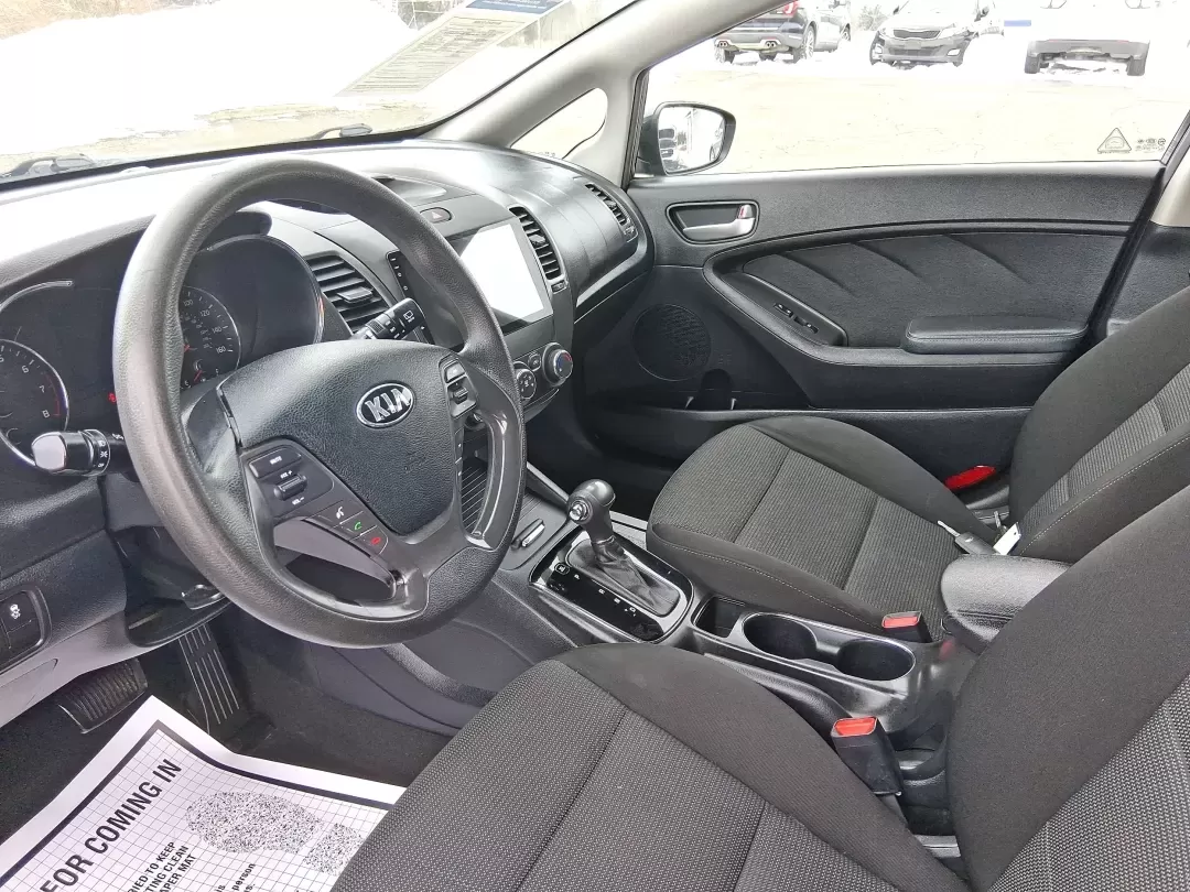 2018 Kia Forte LX (KNAFK5A89J5) with an 2L I-4 DOHC engine, 6A transmission, located at 1951 S Dayton Lakeview Rd., New Carlisle, OH, 45344, (937) 908-9800, 39.890999, -84.050255 - Need a smart, budget-friendly ride that can handle daily commutes to Dayton, quick grocery runs, and spontaneous weekend trips without feeling cramped? This 2018 Kia Forte LX Hatchback in Gravity Blue is built for real-life driving in and around New Carlisle-easy to park, efficient to live with, and - Photo#9