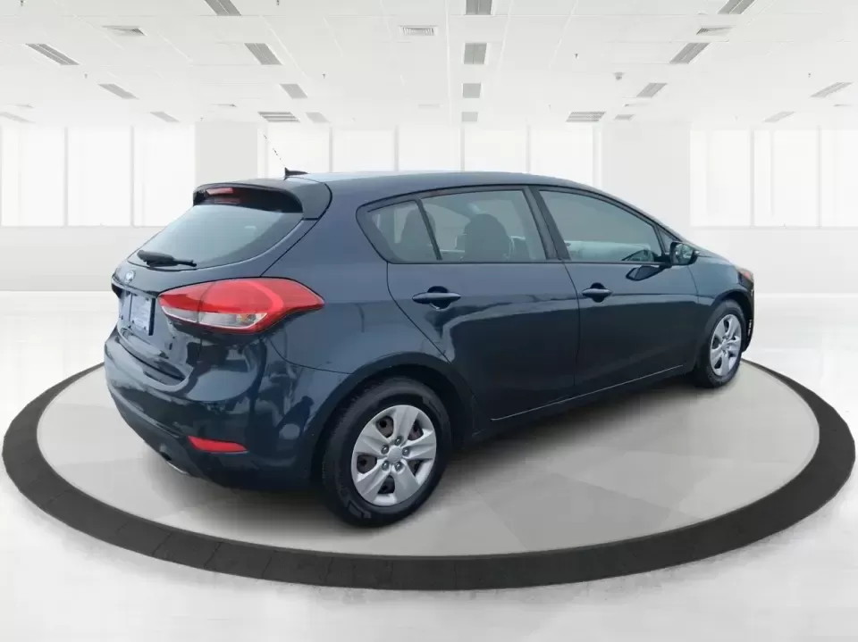 2018 Kia Forte LX (KNAFK5A89J5) with an 2L I-4 DOHC engine, 6A transmission, located at 1951 S Dayton Lakeview Rd., New Carlisle, OH, 45344, (937) 908-9800, 39.890999, -84.050255 - Need a smart, budget-friendly ride that can handle daily commutes to Dayton, quick grocery runs, and spontaneous weekend trips without feeling cramped? This 2018 Kia Forte LX Hatchback in Gravity Blue is built for real-life driving in and around New Carlisle-easy to park, efficient to live with, and - Photo#2