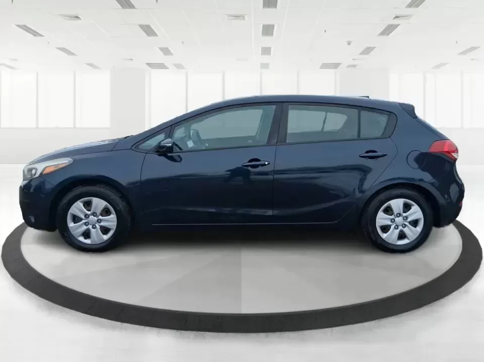 2018 Kia Forte 5-Door LX (KNAFK5A89J5) with an 2.0L L4 DOHC 16V engine, 6A transmission, located at 4508 South Dixie Dr, Moraine, OH, 45439, (937) 908-9800, 39.689976, -84.218452 - Need a smart daily driver that can handle the Monday commute down South Dixie Drive, quick grocery runs near Dayton Mall, and spontaneous weekend getaways without draining your budget? This 2018 Kia Forte 5Door LX hatchback fits real life in Moraine-easy to park, roomy for friends or family, and eff- Photo#5