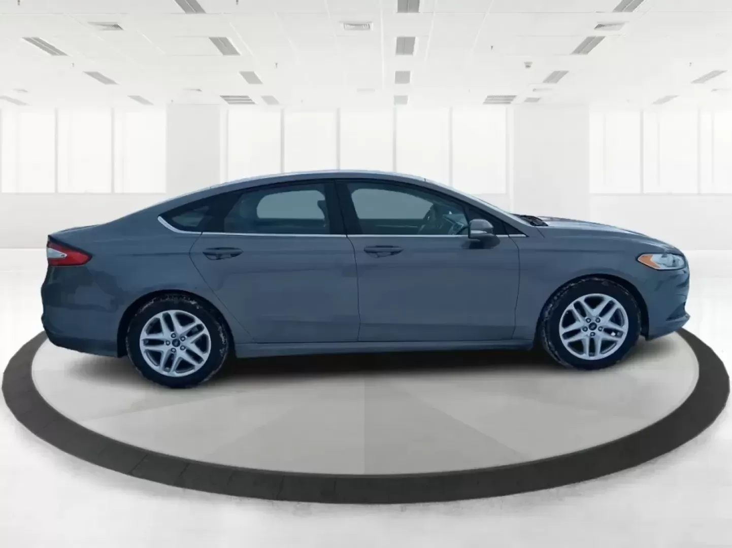 2013 Ford Fusion SE (3FA6P0H72DR) with an 2.5L L4 DOHC 16V engine, Automatic transmission, located at 1951 S Dayton Lakeview Rd., New Carlisle, OH, 45344, (937) 908-9800, 39.890999, -84.050255 - Need a dependable commuter that can handle daily drives to Wright-Patterson AFB, weekend errands around Beavercreek, and the occasional road trip down I-675 without draining your budget? This 2013 Ford Fusion SE in Sterling Gray is a smart, comfortable sedan built for real life-great for long commut - Photo#1