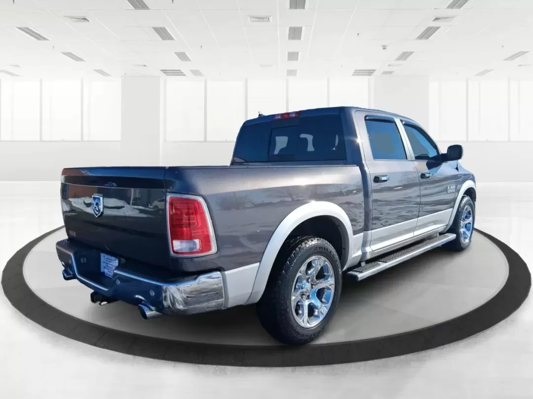 2016 Ram 1500 Laramie (1C6RR7NT1GS) with an 5.7L V8 OHV 16V engine, 6A transmission, located at 1099 N County Rd 25A , Troy, OH, 45373, (937) 908-9800, 40.057079, -84.212883 - Built for Ohio backroads, weekend lake runs, and the kind of workday that doesn't stop when the weather turns, this 2016 Ram 1500 Laramie Crew Cab 4WD is the truck that fits real life in Troy. Whether you're towing a trailer out toward the Miami County Fairgrounds, hauling gear for a Saturday at Tre - Photo#2