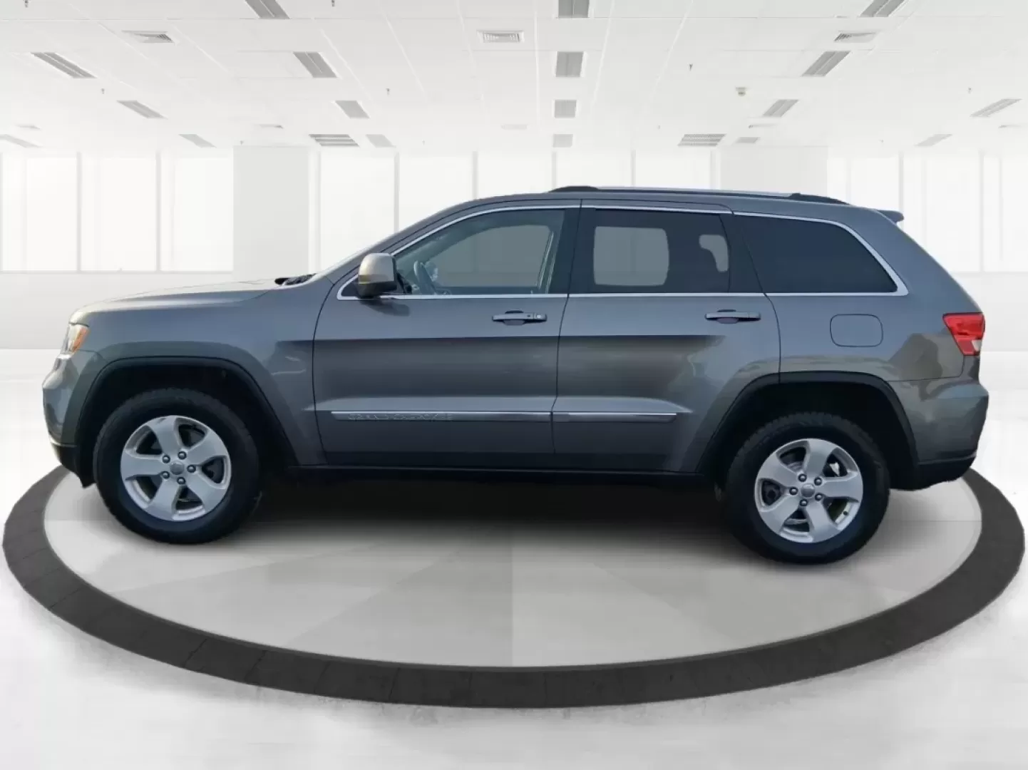 2012 Jeep Grand Cherokee Laredo (1C4RJFAG1CC) with an Other engine, located at 1099 N County Rd 25A , Troy, OH, 45373, (937) 908-9800, 40.057079, -84.212883 - Picture your next weekend escape: loading up the family, pointing the hood toward John A. Wannemacher Nature Reserve, and cruising I75 with confidence no matter what Ohio weather throws your way. This 2012 Jeep Grand Cherokee Laredo is built for real life in Troy-school runs, long commutes to Dayton - Photo#5