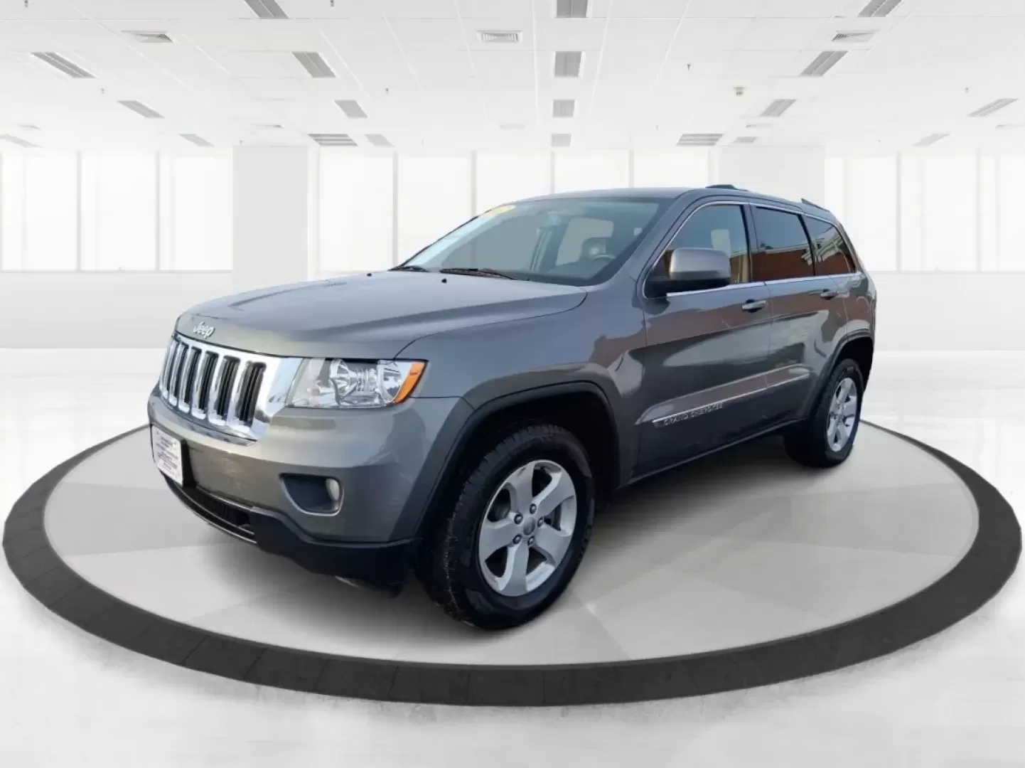 2012 Jeep Grand Cherokee Laredo (1C4RJFAG1CC) with an Other engine, located at 1099 N County Rd 25A , Troy, OH, 45373, (937) 908-9800, 40.057079, -84.212883 - Picture your next weekend escape: loading up the family, pointing the hood toward John A. Wannemacher Nature Reserve, and cruising I75 with confidence no matter what Ohio weather throws your way. This 2012 Jeep Grand Cherokee Laredo is built for real life in Troy-school runs, long commutes to Dayton - Photo#8