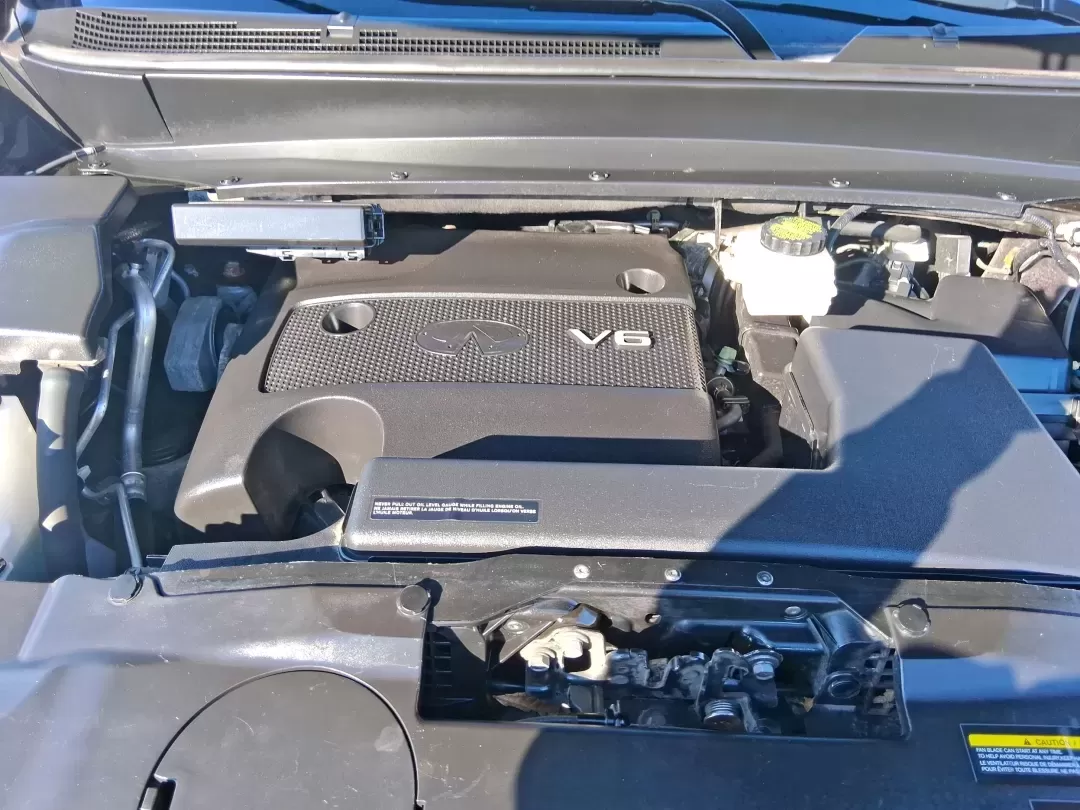 2013 Infiniti JX35 Base (5N1AL0MM9DC) with an 3.5L V6 DOHC 24V engine, Continuously Variable Transmission transmission, located at 1951 S Dayton Lakeview Rd., New Carlisle, OH, 45344, (937) 908-9800, 39.890999, -84.050255 - Need a comfortable, upscale SUV that can handle school drop-offs, I70 commutes, and weekend getaways without blowing the budget? This 2013 INFINITI JX35 Base in rich maroon delivers three-row versatility, premium comfort, and confidence-building safety features-an ideal fit for growing families, bus - Photo#9