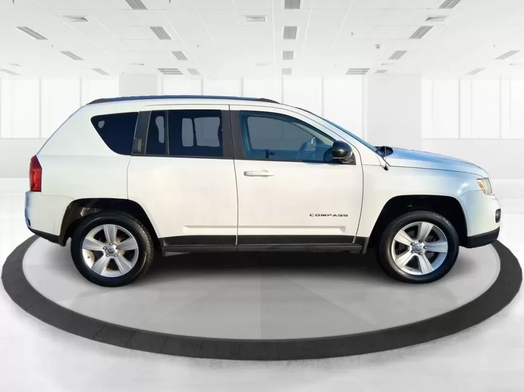 2012 Jeep Compass Latitude (1C4NJDEB4CD) with an 2.4L I-4 DOHC engine, Continuously Variable Transmission transmission, located at 8750 N County Rd 25A, Piqua, OH, 45356, (937) 908-9800, 40.164391, -84.232513 - Need a do-it-all SUV that fits real life in West Central Ohio-school drop-offs, long commutes up I75, and spontaneous weekend escapes to the trails around Johnston Farm and Indian Agency? This 2012 Jeep Compass Latitude 4WD in Bright White Clearcoat is built for that everyday adventure lifestyle, - Photo#1