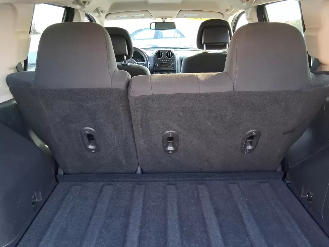 2012 Jeep Compass Latitude (1C4NJDEB4CD) with an 2.4L I-4 DOHC engine, Continuously Variable Transmission transmission, located at 8750 N County Rd 25A, Piqua, OH, 45356, (937) 908-9800, 40.164391, -84.232513 - Need a do-it-all SUV that fits real life in West Central Ohio-school drop-offs, long commutes up I75, and spontaneous weekend escapes to the trails around Johnston Farm and Indian Agency? This 2012 Jeep Compass Latitude 4WD in Bright White Clearcoat is built for that everyday adventure lifestyle, - Photo#11