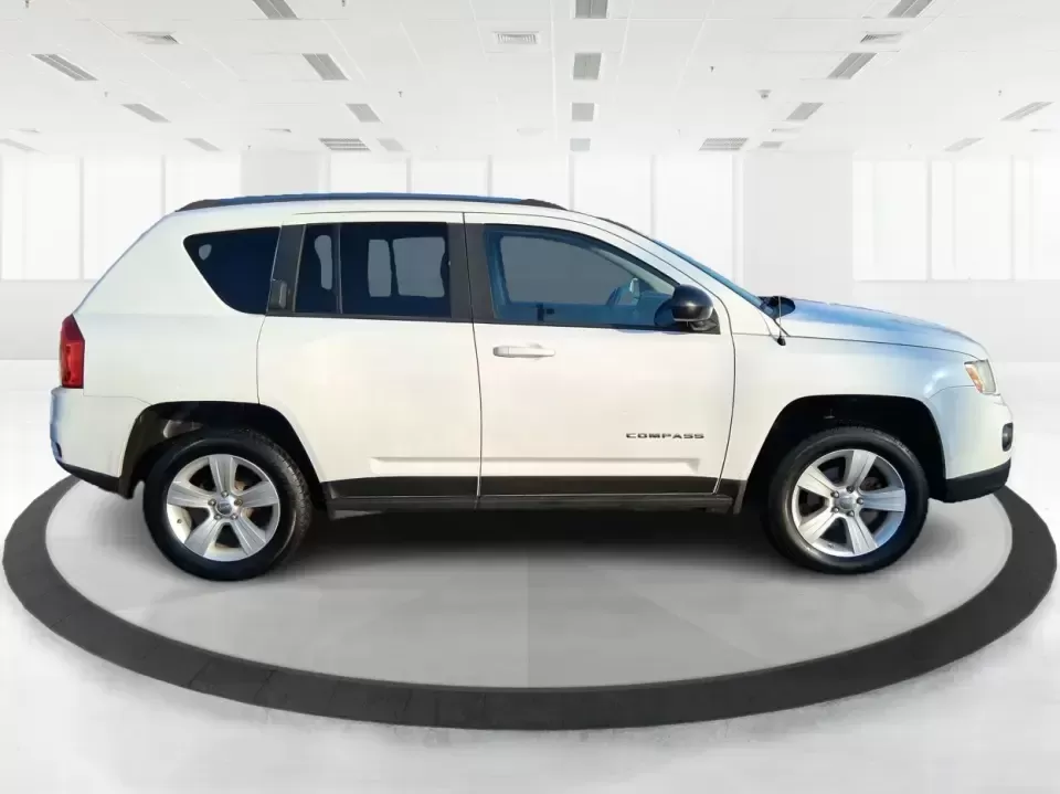 2012 Jeep Compass Latitude (1C4NJDEB4CD) with an 2.4L I-4 DOHC engine, Continuously Variable Transmission transmission, located at 4508 South Dixie Dr, Moraine, OH, 45439, (937) 908-9800, 39.689976, -84.218452 - Need a do-it-all SUV that fits real life in West Central Ohio-school drop-offs, long commutes up I75, and spontaneous weekend escapes to the trails around Johnston Farm and Indian Agency? This 2012 Jeep Compass Latitude 4WD in Bright White Clearcoat is built for that everyday adventure lifestyle, - Photo#1