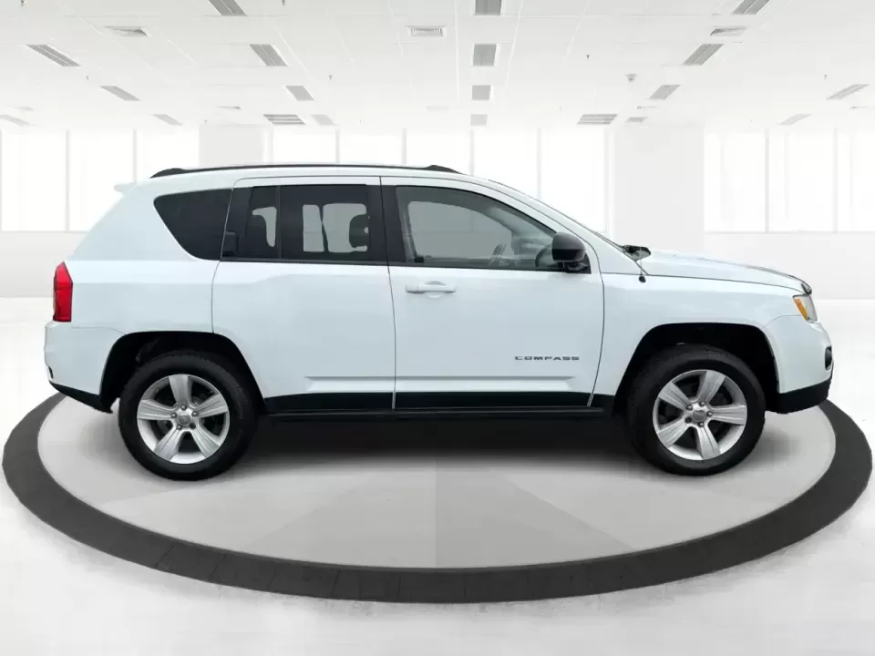 2012 Jeep Compass Latitude (1C4NJDEB4CD) with an 2.4L I-4 DOHC engine, Continuously Variable Transmission transmission, located at 1230 East Main St, Xenia, OH, 45385, (937) 908-9800, 39.688026, -83.910172 - Need a do-it-all SUV that fits real life in West Central Ohio-school drop-offs, long commutes up I75, and spontaneous weekend escapes to the trails around Johnston Farm and Indian Agency? This 2012 Jeep Compass Latitude 4WD in Bright White Clearcoat is built for that everyday adventure lifestyle, - Photo#1