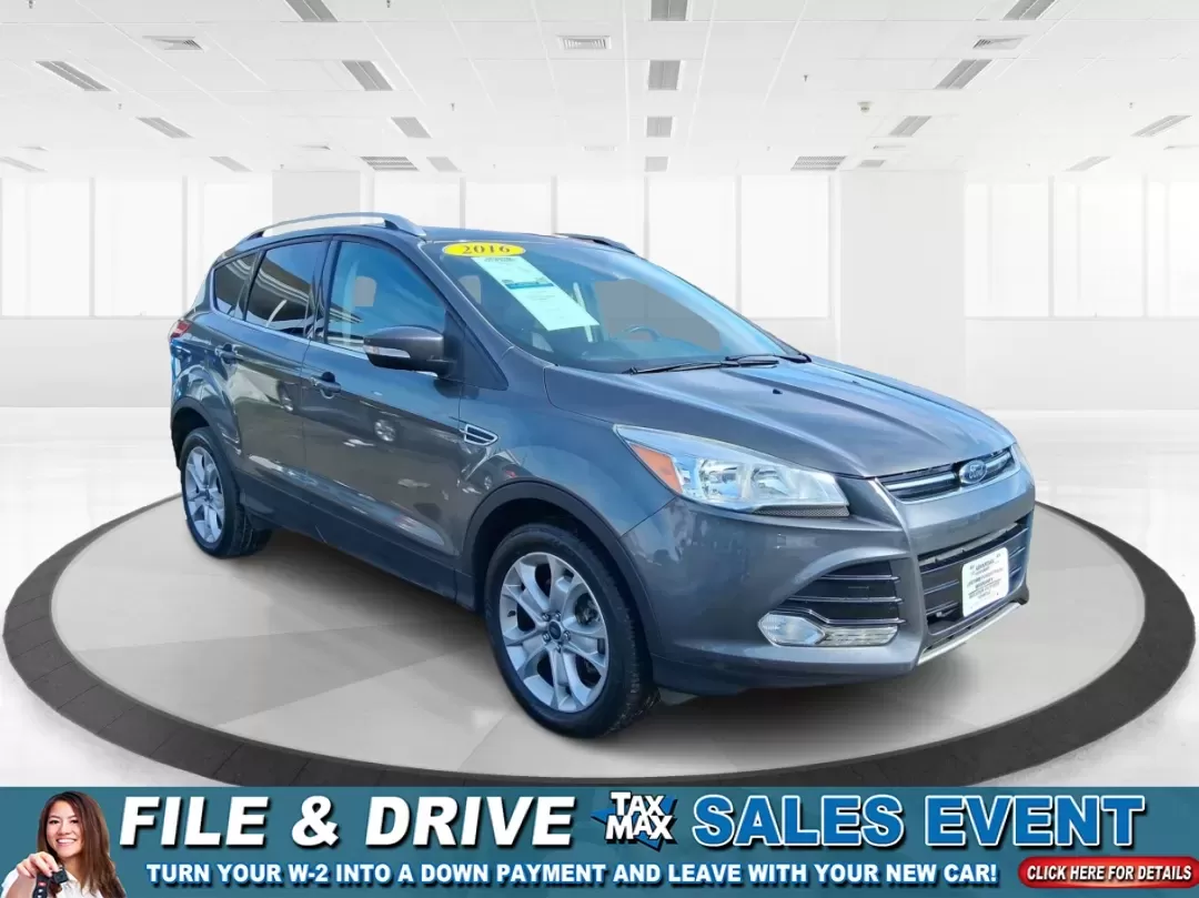 2016 Ford Escape Titanium (1FMCU9J94GU) with an 2.0L L4 DOHC 16V engine, 6-Speed Automatic transmission, located at 1951 S Dayton Lakeview Rd., New Carlisle, OH, 45344, (937) 908-9800, 39.890999, -84.050255 - Picture your next Ohio weekend: a quick grocery run through New Carlisle, a comfortable commute toward Dayton, and then a spontaneous road trip out I70 with the family-without worrying about weather, cargo space, or comfort. This 2016 Ford Escape Titanium in sleek Magnetic is the kind of compact SUV - Photo#0