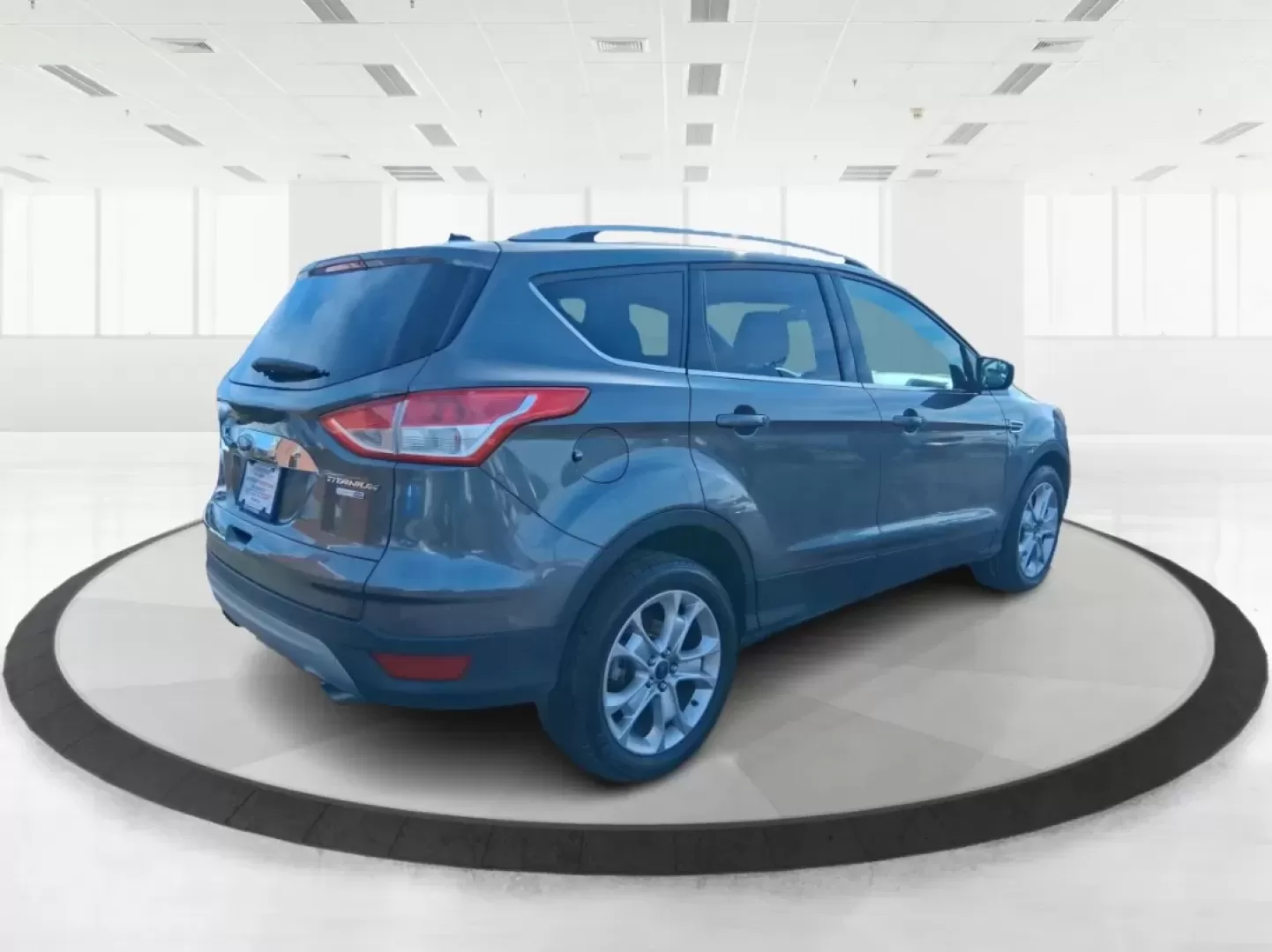 2016 Ford Escape Titanium (1FMCU9J94GU) with an 2.0L L4 DOHC 16V engine, 6-Speed Automatic transmission, located at 1951 S Dayton Lakeview Rd., New Carlisle, OH, 45344, (937) 908-9800, 39.890999, -84.050255 - Picture your next Ohio weekend: a quick grocery run through New Carlisle, a comfortable commute toward Dayton, and then a spontaneous road trip out I70 with the family-without worrying about weather, cargo space, or comfort. This 2016 Ford Escape Titanium in sleek Magnetic is the kind of compact SUV - Photo#2