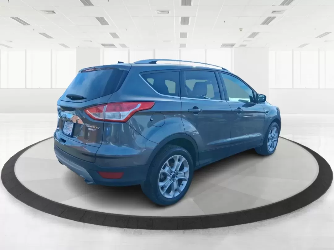 2016 Ford Escape Titanium (1FMCU9J94GU) with an 2.0L L4 DOHC 16V engine, 6-Speed Automatic transmission, located at 1951 S Dayton Lakeview Rd., New Carlisle, OH, 45344, (937) 908-9800, 39.890999, -84.050255 - Picture your next Ohio weekend: a quick grocery run through New Carlisle, a comfortable commute toward Dayton, and then a spontaneous road trip out I70 with the family-without worrying about weather, cargo space, or comfort. This 2016 Ford Escape Titanium in sleek Magnetic is the kind of compact SUV - Photo#2
