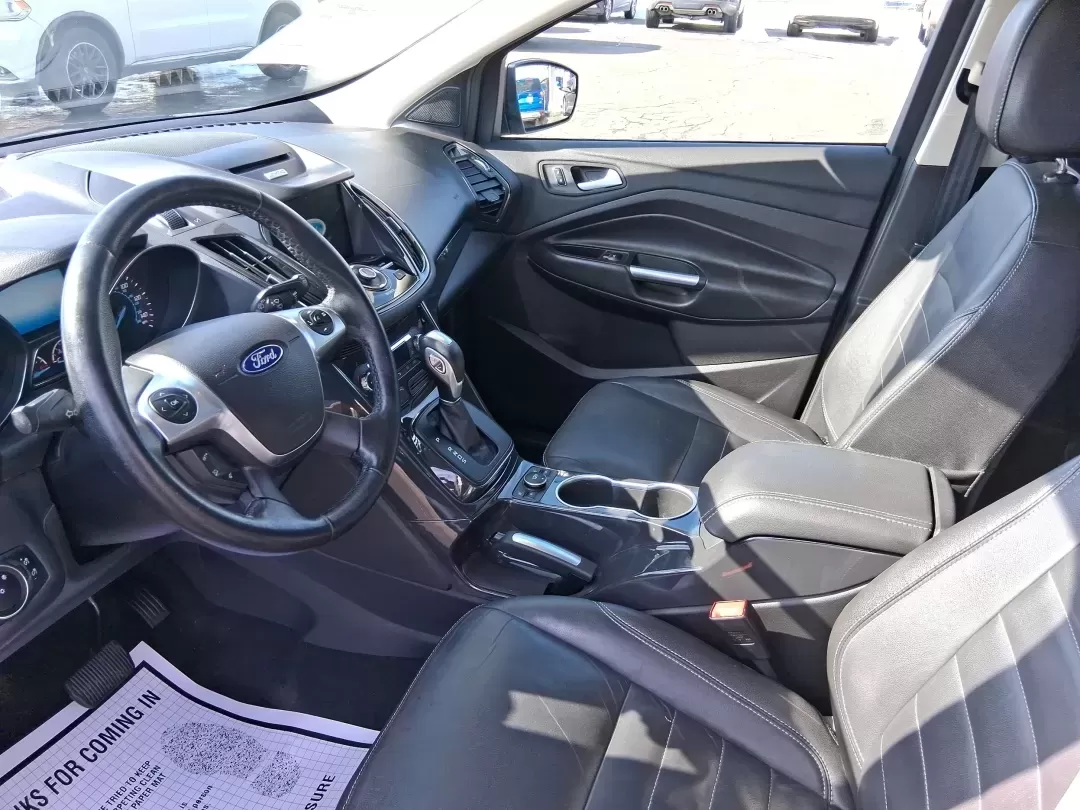 2016 Ford Escape Titanium (1FMCU9J94GU) with an 2.0L L4 DOHC 16V engine, 6-Speed Automatic transmission, located at 1951 S Dayton Lakeview Rd., New Carlisle, OH, 45344, (937) 908-9800, 39.890999, -84.050255 - Picture your next Ohio weekend: a quick grocery run through New Carlisle, a comfortable commute toward Dayton, and then a spontaneous road trip out I70 with the family-without worrying about weather, cargo space, or comfort. This 2016 Ford Escape Titanium in sleek Magnetic is the kind of compact SUV - Photo#9