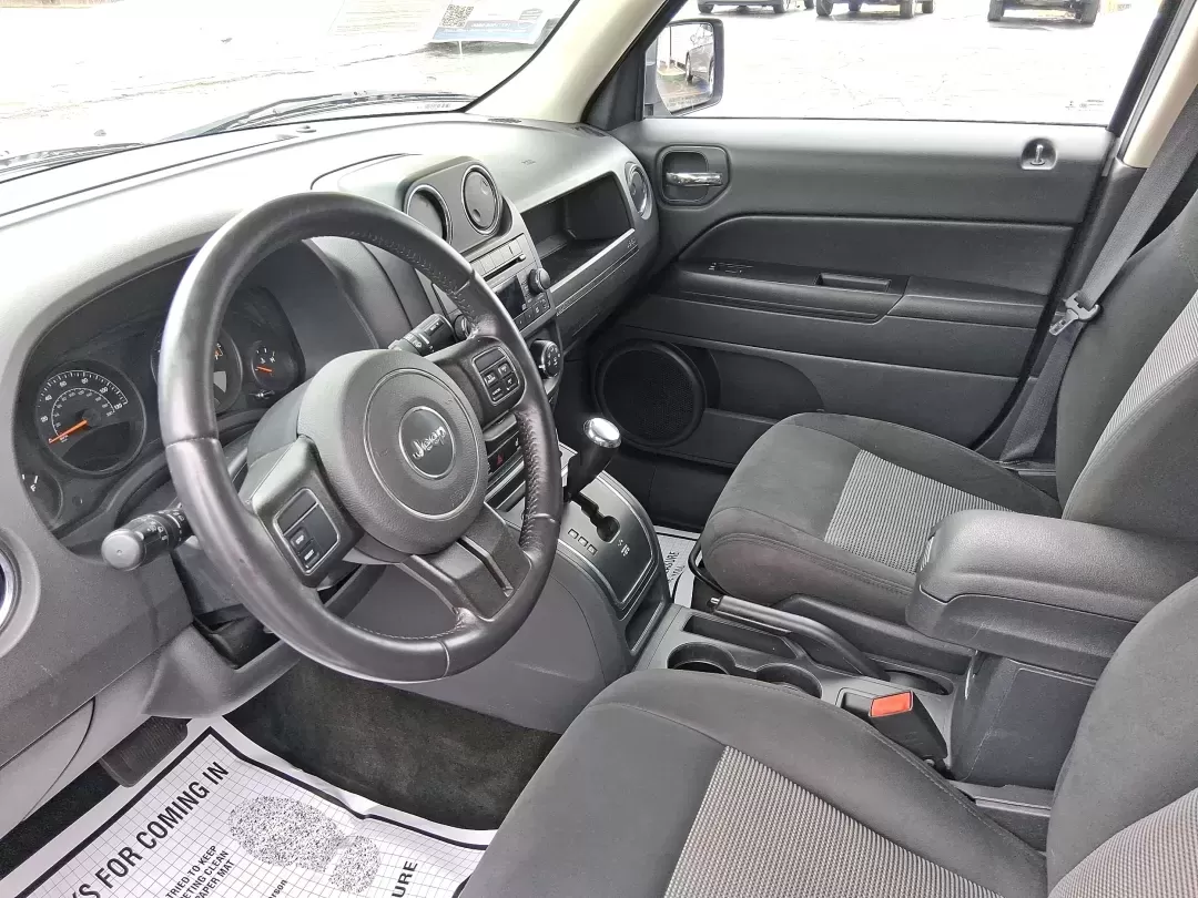 2016 Jeep Patriot Latitude (1C4NJPFA8GD) with an 2.0L L4 DOHC 16V engine, located at 1951 S Dayton Lakeview Rd., New Carlisle, OH, 45344, (937) 908-9800, 39.890999, -84.050255 - Picture your next weekend escape: loading up the gear, pointing the hood toward John Bryan State Park or a day trip to Dayton, and enjoying the confident, go-anywhere feel that makes a Jeep a Jeep. This **2016 Jeep Patriot Latitude** is a smart fit for commuters, first-time buyers, and budget-consci - Photo#9