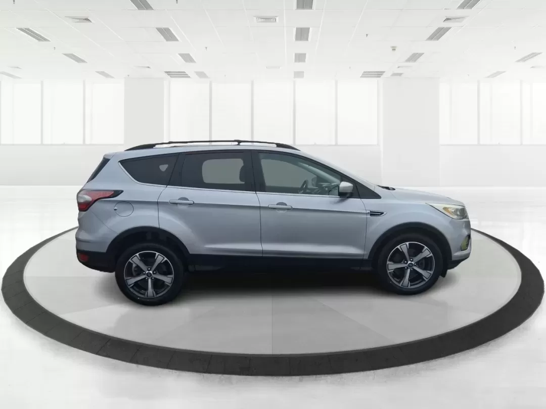 2017 Ford Escape SE (1FMCU0GD5HU) with an 1.5L L4 DOHC 16V engine, 6A transmission, located at 1099 N County Rd 25A , Troy, OH, 45373, (937) 908-9800, 40.057079, -84.212883 - Picture your next Ohio weekend: a quick run up I75 for errands, a family day at Treasure Island Park, or a spontaneous road trip to Dayton-without worrying about space, comfort, or winter-ready confidence. This 2017 Ford Escape SE SUV is built for real life in Troy, offering the easy maneuverability - Photo#1