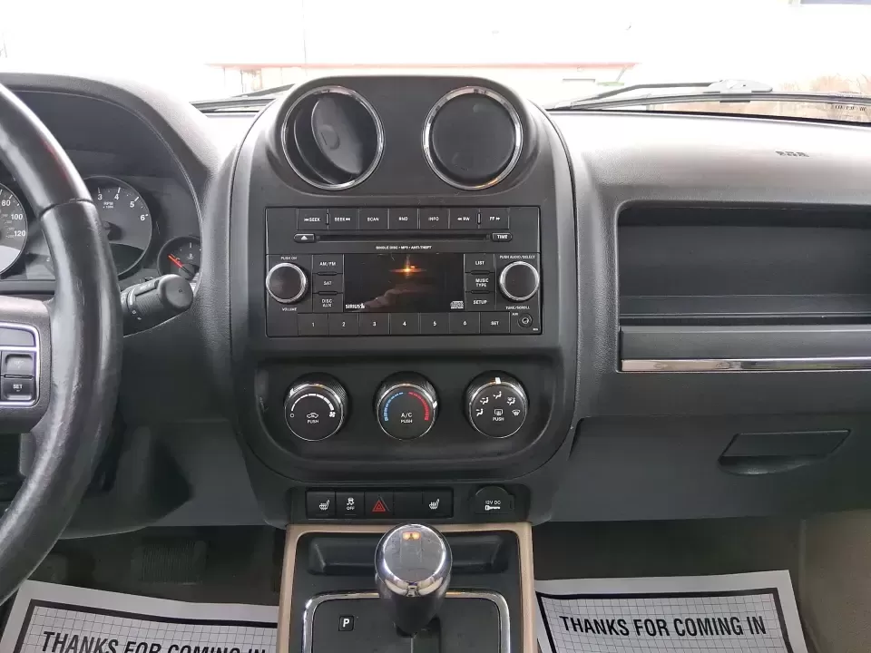 2012 Jeep Patriot Latitude (1C4NJPFB0CD) with an 2.4L L4 DOHC 16V engine, located at 1099 N County Rd 25A , Troy, OH, 45373, (937) 908-9800, 40.057079, -84.212883 - Picture your next weekend: a quick run up I-75 for a family visit, a scenic drive past the Miami River, then an easy loop back through downtown Troy for dinner-without worrying about whether your SUV can keep up with daily life. This 2012 Jeep Patriot Latitude is built for practical adventures and e - Photo#13