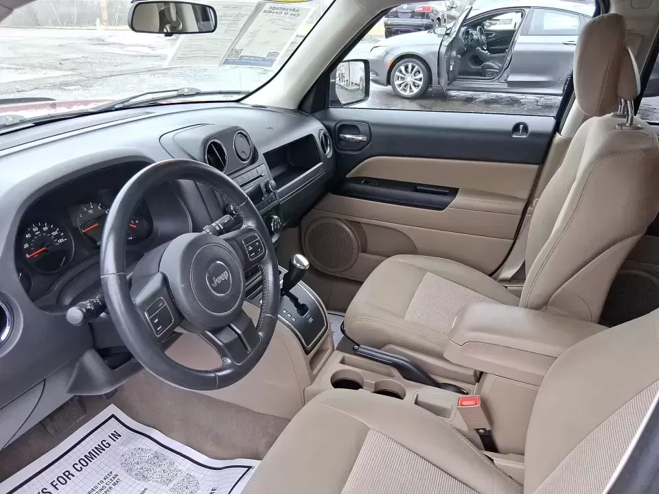 2012 Jeep Patriot Latitude (1C4NJPFB0CD) with an 2.4L L4 DOHC 16V engine, located at 1230 East Main St, Xenia, OH, 45385, (937) 908-9800, 39.688026, -83.910172 - Picture your next weekend: a quick run up I-75 for a family visit, a scenic drive past the Miami River, then an easy loop back through downtown Troy for dinner-without worrying about whether your SUV can keep up with daily life. This 2012 Jeep Patriot Latitude is built for practical adventures and e - Photo#9