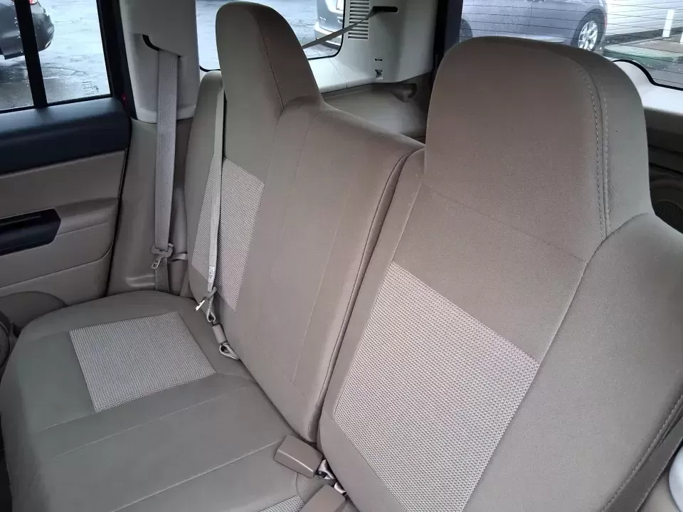 2012 Jeep Patriot Latitude (1C4NJPFB0CD) with an 2.4L L4 DOHC 16V engine, located at 1230 East Main St, Xenia, OH, 45385, (937) 908-9800, 39.688026, -83.910172 - Picture your next weekend: a quick run up I-75 for a family visit, a scenic drive past the Miami River, then an easy loop back through downtown Troy for dinner-without worrying about whether your SUV can keep up with daily life. This 2012 Jeep Patriot Latitude is built for practical adventures and e - Photo#10