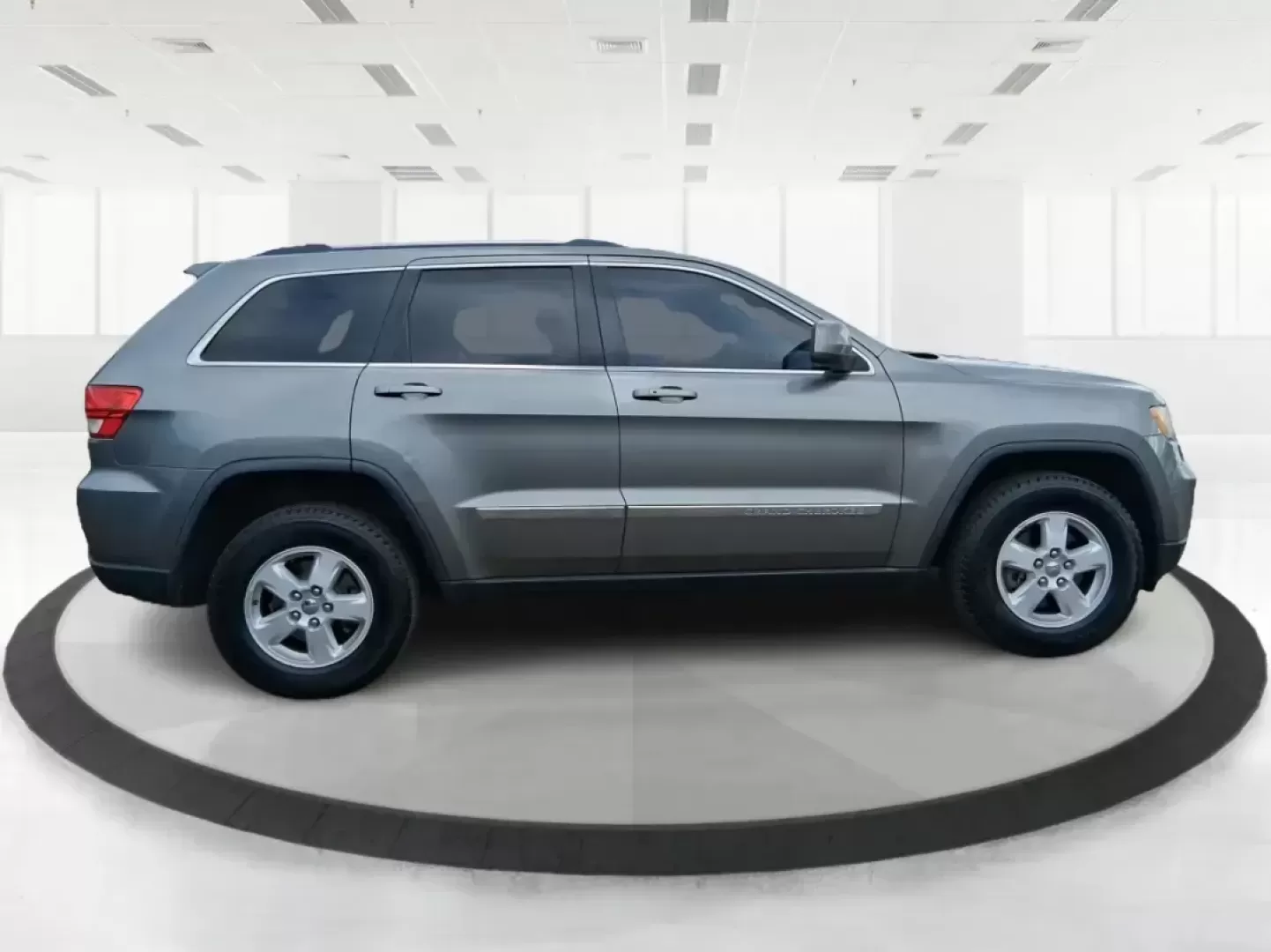 2013 Jeep Grand Cherokee Laredo (1C4RJFAG1DC) with an 3.6L V6 DOHC 24V engine, 5-Speed Automatic transmission, located at 401 Woodman Dr, Riverside, OH, 45431, (937) 908-9800, 39.760899, -84.123421 - Pack up the family, point the hood toward the next weekend getaway, and enjoy the confidence that comes with a capable SUV built for real life in Ohio. This 2013 Jeep Grand Cherokee Laredo in Mineral Gray Metallic Clearcoat is the kind of vehicle that fits your routine Monday through Friday-then tur - Photo#1