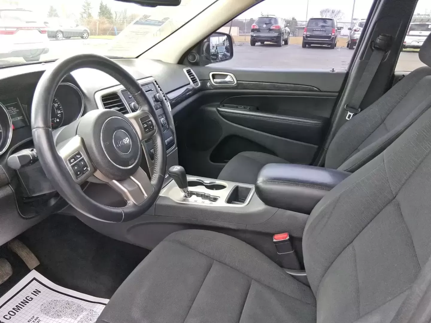 2013 Jeep Grand Cherokee Laredo (1C4RJFAG1DC) with an 3.6L V6 DOHC 24V engine, 5-Speed Automatic transmission, located at 401 Woodman Dr, Riverside, OH, 45431, (937) 908-9800, 39.760899, -84.123421 - Pack up the family, point the hood toward the next weekend getaway, and enjoy the confidence that comes with a capable SUV built for real life in Ohio. This 2013 Jeep Grand Cherokee Laredo in Mineral Gray Metallic Clearcoat is the kind of vehicle that fits your routine Monday through Friday-then tur - Photo#9