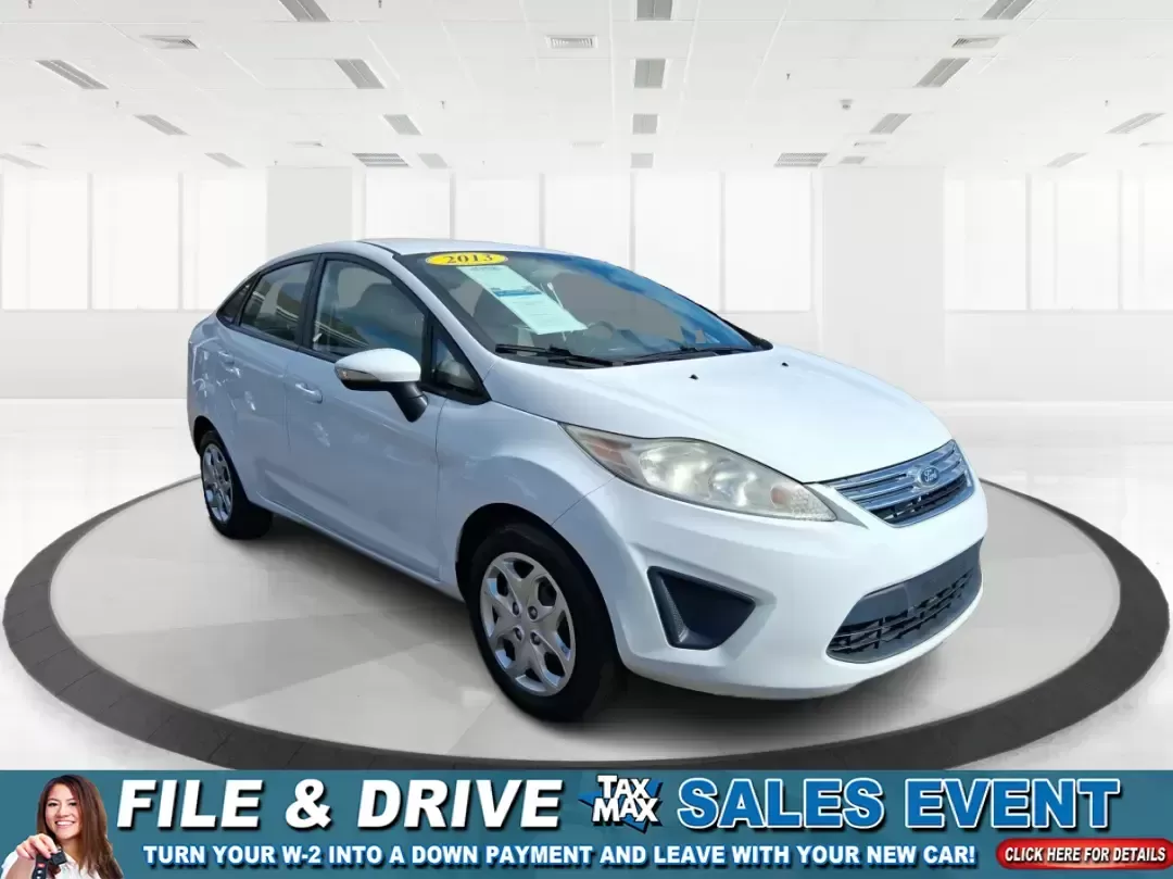 2013 Ford Fiesta SE (3FADP4BJXDM) with an 1.6L I-4 DOHC engine, located at 1951 S Dayton Lakeview Rd., New Carlisle, OH, 45344, (937) 908-9800, 39.890999, -84.050255 - Need a smart, efficient commuter that's easy to park downtown, nimble on I70, and still comfortable for weekend errands or a quick getaway to Springfield or Dayton? This 2013 Ford Fiesta SE Sedan in Oxford White delivers practical daily driving with the kind of budget-friendly ownership that fits re - Photo#0