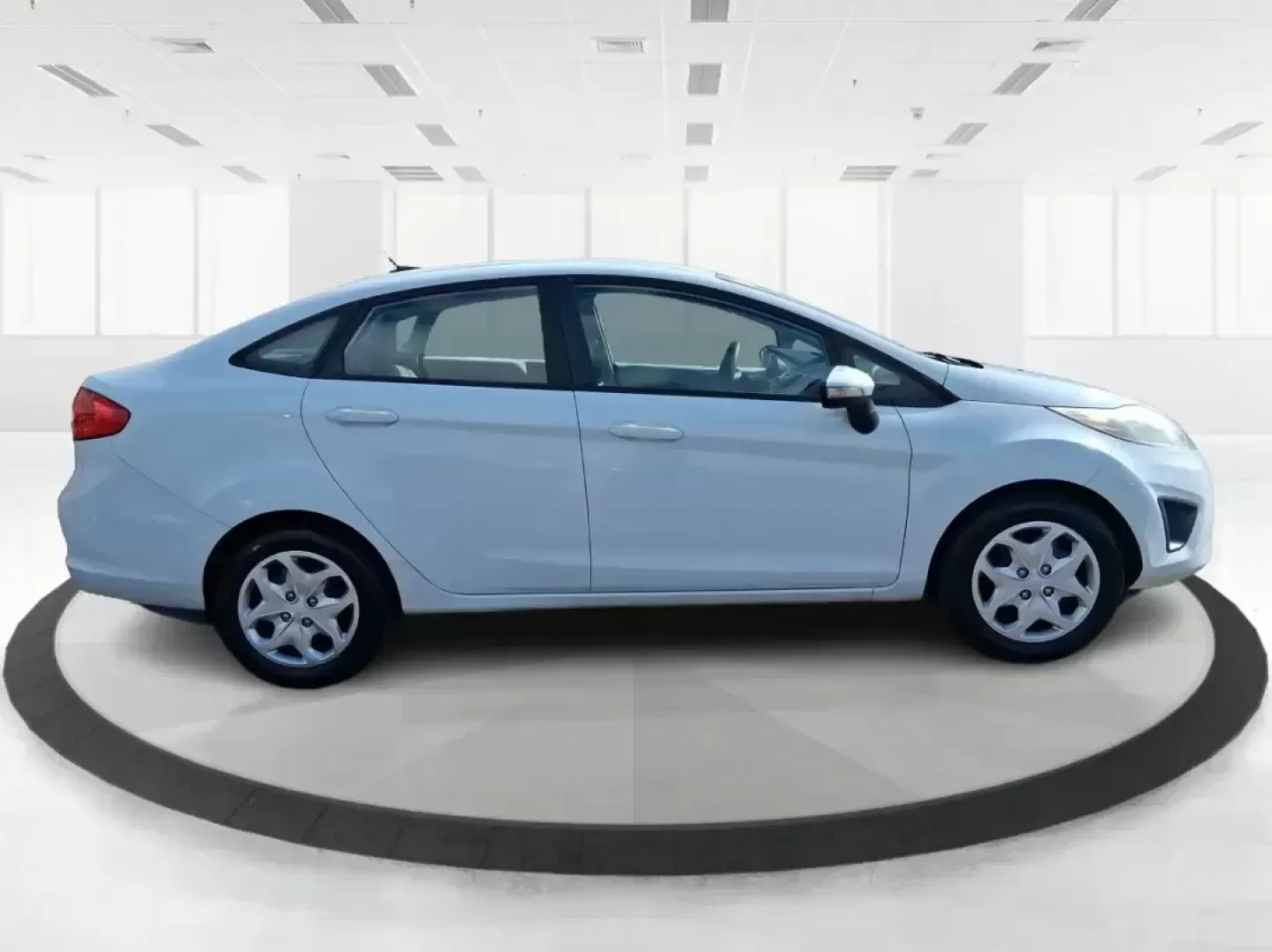 2013 Ford Fiesta SE (3FADP4BJXDM) with an 1.6L I-4 DOHC engine, located at 1951 S Dayton Lakeview Rd., New Carlisle, OH, 45344, (937) 908-9800, 39.890999, -84.050255 - Need a smart, efficient commuter that's easy to park downtown, nimble on I70, and still comfortable for weekend errands or a quick getaway to Springfield or Dayton? This 2013 Ford Fiesta SE Sedan in Oxford White delivers practical daily driving with the kind of budget-friendly ownership that fits re - Photo#1