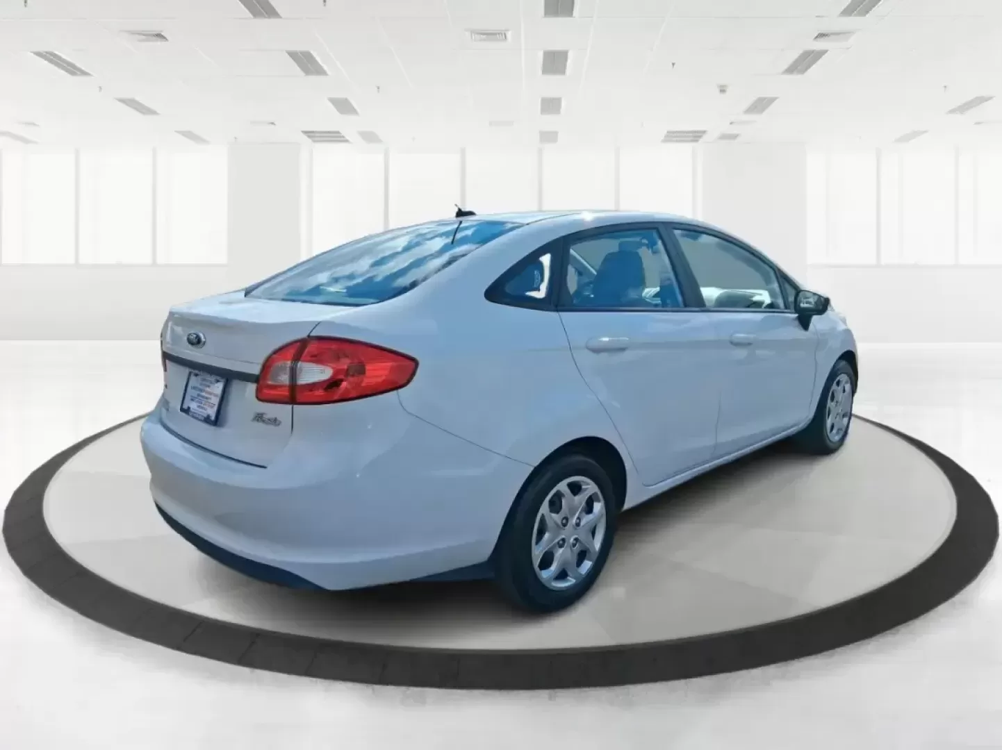 2013 Ford Fiesta SE (3FADP4BJXDM) with an 1.6L I-4 DOHC engine, located at 1951 S Dayton Lakeview Rd., New Carlisle, OH, 45344, (937) 908-9800, 39.890999, -84.050255 - Need a smart, efficient commuter that's easy to park downtown, nimble on I70, and still comfortable for weekend errands or a quick getaway to Springfield or Dayton? This 2013 Ford Fiesta SE Sedan in Oxford White delivers practical daily driving with the kind of budget-friendly ownership that fits re - Photo#2