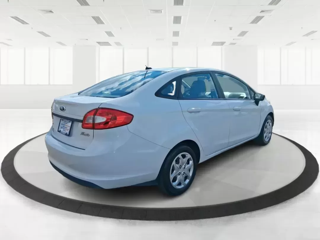 2013 Ford Fiesta SE (3FADP4BJXDM) with an 1.6L I-4 DOHC engine, located at 1951 S Dayton Lakeview Rd., New Carlisle, OH, 45344, (937) 908-9800, 39.890999, -84.050255 - Need a smart, efficient commuter that's easy to park downtown, nimble on I70, and still comfortable for weekend errands or a quick getaway to Springfield or Dayton? This 2013 Ford Fiesta SE Sedan in Oxford White delivers practical daily driving with the kind of budget-friendly ownership that fits re - Photo#2