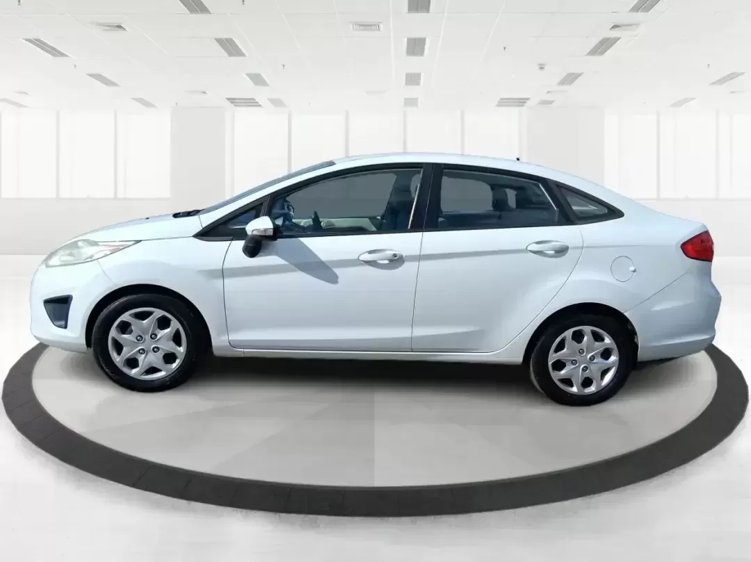 2013 Ford Fiesta SE (3FADP4BJXDM) with an 1.6L I-4 DOHC engine, located at 1951 S Dayton Lakeview Rd., New Carlisle, OH, 45344, (937) 908-9800, 39.890999, -84.050255 - Need a smart, efficient commuter that's easy to park downtown, nimble on I70, and still comfortable for weekend errands or a quick getaway to Springfield or Dayton? This 2013 Ford Fiesta SE Sedan in Oxford White delivers practical daily driving with the kind of budget-friendly ownership that fits re - Photo#5