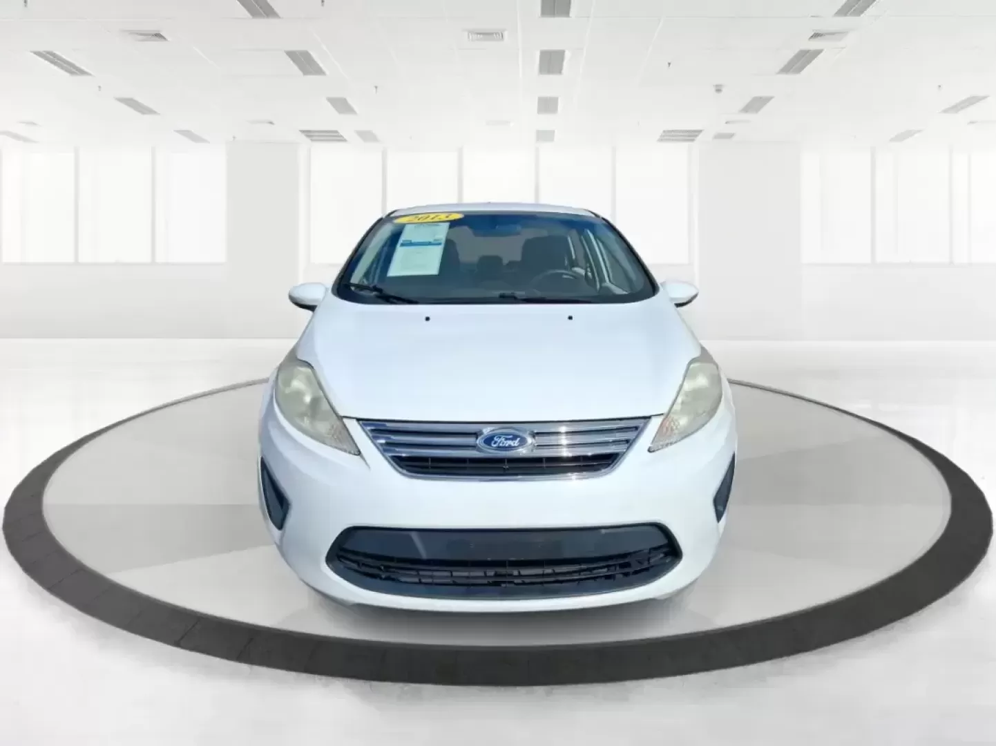 2013 Ford Fiesta SE (3FADP4BJXDM) with an 1.6L I-4 DOHC engine, located at 1951 S Dayton Lakeview Rd., New Carlisle, OH, 45344, (937) 908-9800, 39.890999, -84.050255 - Need a smart, efficient commuter that's easy to park downtown, nimble on I70, and still comfortable for weekend errands or a quick getaway to Springfield or Dayton? This 2013 Ford Fiesta SE Sedan in Oxford White delivers practical daily driving with the kind of budget-friendly ownership that fits re - Photo#7