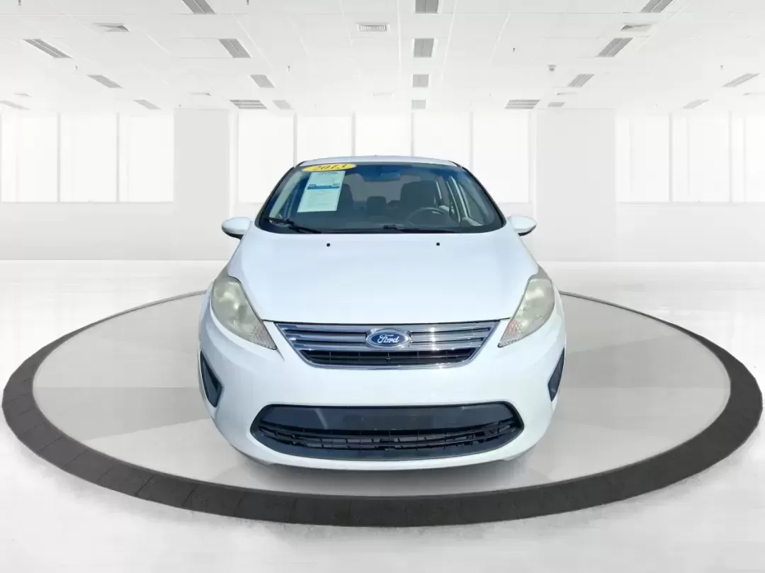 2013 Ford Fiesta SE (3FADP4BJXDM) with an 1.6L I-4 DOHC engine, located at 1951 S Dayton Lakeview Rd., New Carlisle, OH, 45344, (937) 908-9800, 39.890999, -84.050255 - Need a smart, efficient commuter that's easy to park downtown, nimble on I70, and still comfortable for weekend errands or a quick getaway to Springfield or Dayton? This 2013 Ford Fiesta SE Sedan in Oxford White delivers practical daily driving with the kind of budget-friendly ownership that fits re - Photo#7