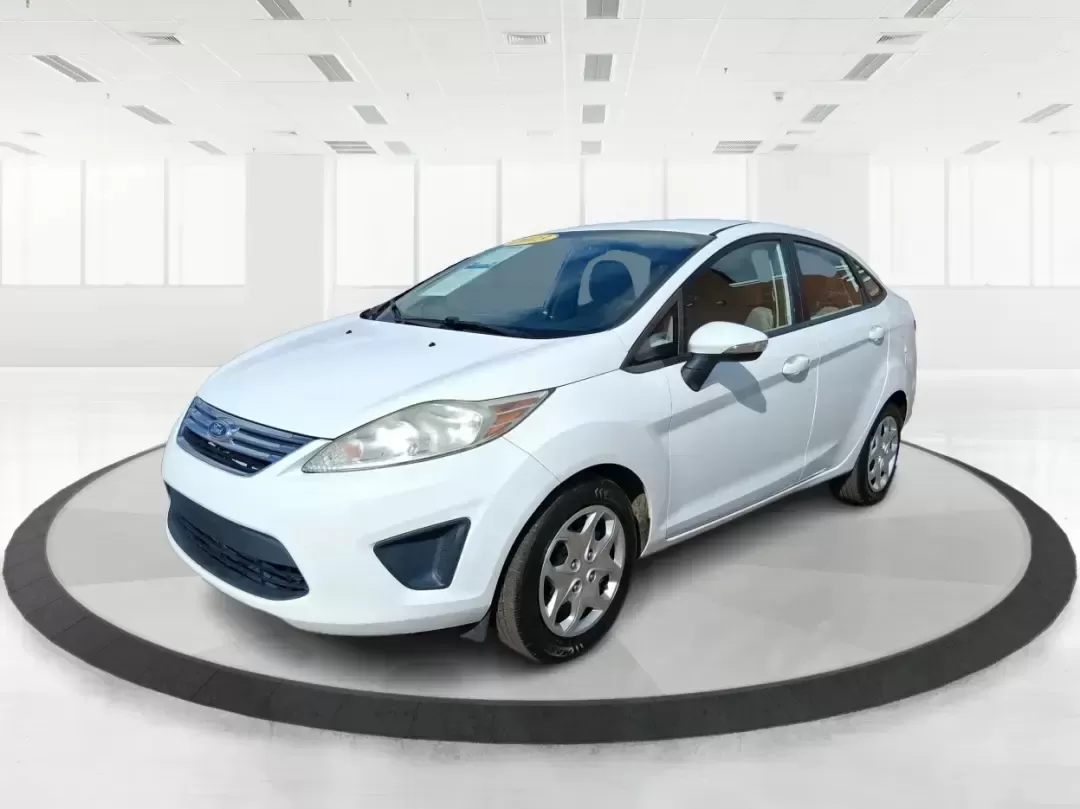 2013 Ford Fiesta SE (3FADP4BJXDM) with an 1.6L I-4 DOHC engine, located at 1951 S Dayton Lakeview Rd., New Carlisle, OH, 45344, (937) 908-9800, 39.890999, -84.050255 - Need a smart, efficient commuter that's easy to park downtown, nimble on I70, and still comfortable for weekend errands or a quick getaway to Springfield or Dayton? This 2013 Ford Fiesta SE Sedan in Oxford White delivers practical daily driving with the kind of budget-friendly ownership that fits re - Photo#8