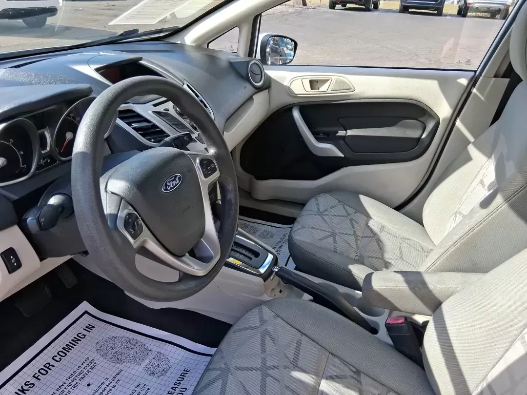 2013 Ford Fiesta SE (3FADP4BJXDM) with an 1.6L I-4 DOHC engine, located at 1951 S Dayton Lakeview Rd., New Carlisle, OH, 45344, (937) 908-9800, 39.890999, -84.050255 - Need a smart, efficient commuter that's easy to park downtown, nimble on I70, and still comfortable for weekend errands or a quick getaway to Springfield or Dayton? This 2013 Ford Fiesta SE Sedan in Oxford White delivers practical daily driving with the kind of budget-friendly ownership that fits re - Photo#9