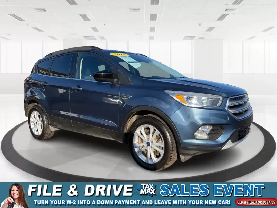 2018 Ford Escape SE (1FMCU9GD4JU) with an 1.5L L4 DOHC 16V engine, 6A transmission, located at 880 E. National Road, Vandalia, OH, 45377, (937) 908-9800, 39.891918, -84.183594 - Picture your next Ohio weekend: loading up the kids for a splash at Splash Xenia, cruising out to John Bryan State Park for a hike, or tackling a snowy morning commute from Beavercreek to downtown Dayton with confidence. This 2018 Ford Escape SE in Blue Metallic is the kind of compact SUV that fits - Photo#0