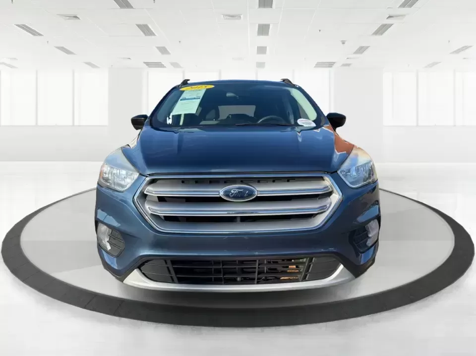 2018 Ford Escape SE (1FMCU9GD4JU) with an 1.5L L4 DOHC 16V engine, 6A transmission, located at 880 E. National Road, Vandalia, OH, 45377, (937) 908-9800, 39.891918, -84.183594 - Picture your next Ohio weekend: loading up the kids for a splash at Splash Xenia, cruising out to John Bryan State Park for a hike, or tackling a snowy morning commute from Beavercreek to downtown Dayton with confidence. This 2018 Ford Escape SE in Blue Metallic is the kind of compact SUV that fits - Photo#7