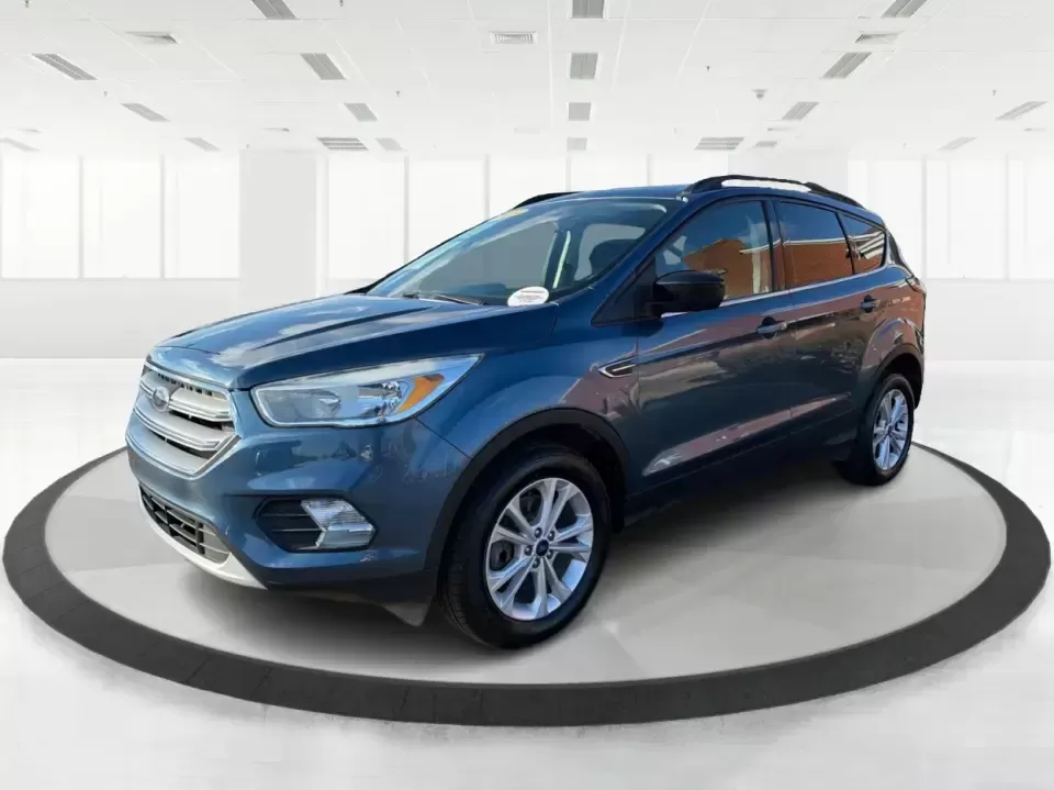 2018 Ford Escape SE (1FMCU9GD4JU) with an 1.5L L4 DOHC 16V engine, 6A transmission, located at 880 E. National Road, Vandalia, OH, 45377, (937) 908-9800, 39.891918, -84.183594 - Picture your next Ohio weekend: loading up the kids for a splash at Splash Xenia, cruising out to John Bryan State Park for a hike, or tackling a snowy morning commute from Beavercreek to downtown Dayton with confidence. This 2018 Ford Escape SE in Blue Metallic is the kind of compact SUV that fits - Photo#8