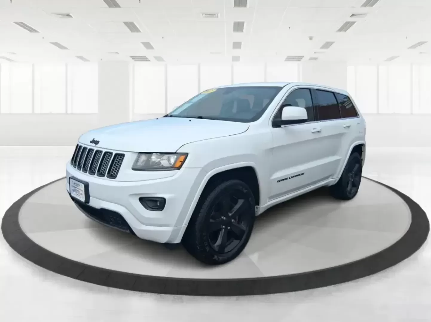 2015 Jeep Grand Cherokee Altitude (1C4RJFAG9FC) with an 3.6L V-6 DOHC engine, 8-Speed Automatic transmission, located at 1099 N County Rd 25A , Troy, OH, 45373, (937) 908-9800, 40.057079, -84.212883 - Weekend getaways to Hocking Hills, snowy school runs, or a confident daily commute up I75 feel easier when your SUV is built for real Ohio weather and real-life schedules. This 2015 Jeep Grand Cherokee Altitude in Bright White Clearcoat is the kind of capable, comfortable SUV that fits busy families - Photo#8