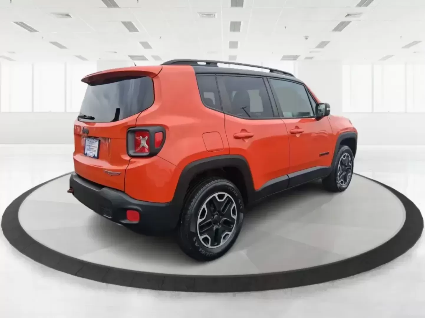 2016 Jeep Renegade Trailhawk (ZACCJBCT5GP) with an Tigershark MultiAir 2.4L I-4 variable valve contro engine, 9A transmission, located at 8750 N County Rd 25A, Piqua, OH, 45356, (937) 908-9800, 40.164391, -84.232513 - Weekend escapes, snowy commutes, and everyday errands feel easier when your crossover is ready for whatever Ohio throws your way. This **2016 Jeep Renegade Trailhawk** in eye-catching **Omaha Orange** is built for drivers who want real capability in a city-friendly size-perfect for exploring MetroPa - Photo#2