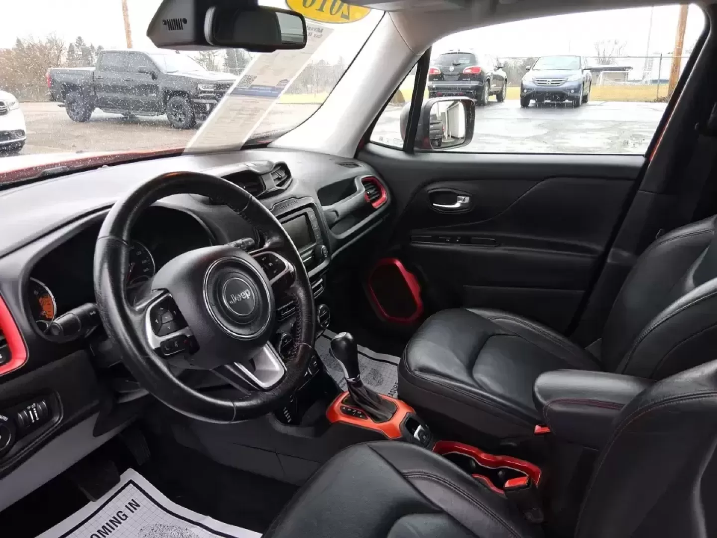 2016 Jeep Renegade Trailhawk (ZACCJBCT5GP) with an Tigershark MultiAir 2.4L I-4 variable valve contro engine, 9A transmission, located at 8750 N County Rd 25A, Piqua, OH, 45356, (937) 908-9800, 40.164391, -84.232513 - Weekend escapes, snowy commutes, and everyday errands feel easier when your crossover is ready for whatever Ohio throws your way. This **2016 Jeep Renegade Trailhawk** in eye-catching **Omaha Orange** is built for drivers who want real capability in a city-friendly size-perfect for exploring MetroPa - Photo#9