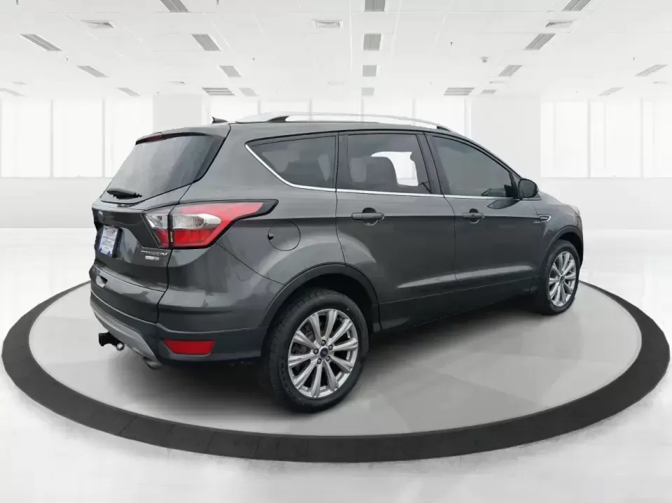 2017 Ford Escape Titanium (1FMCU9J94HU) with an 2.0L L4 DOHC 16V engine, 6A transmission, located at 1951 S Dayton Lakeview Rd., New Carlisle, OH, 45344, (937) 908-9800, 39.890999, -84.050255 - Pack the gear, load up the family, and point the GPS toward your next weekend escape-this 2017 Ford Escape Titanium is the kind of compact SUV that fits real life in Piqua. Whether you're commuting up I75, running errands along N County Rd 25A, or planning a day trip to Lock 9 Park and the Great Mia - Photo#2