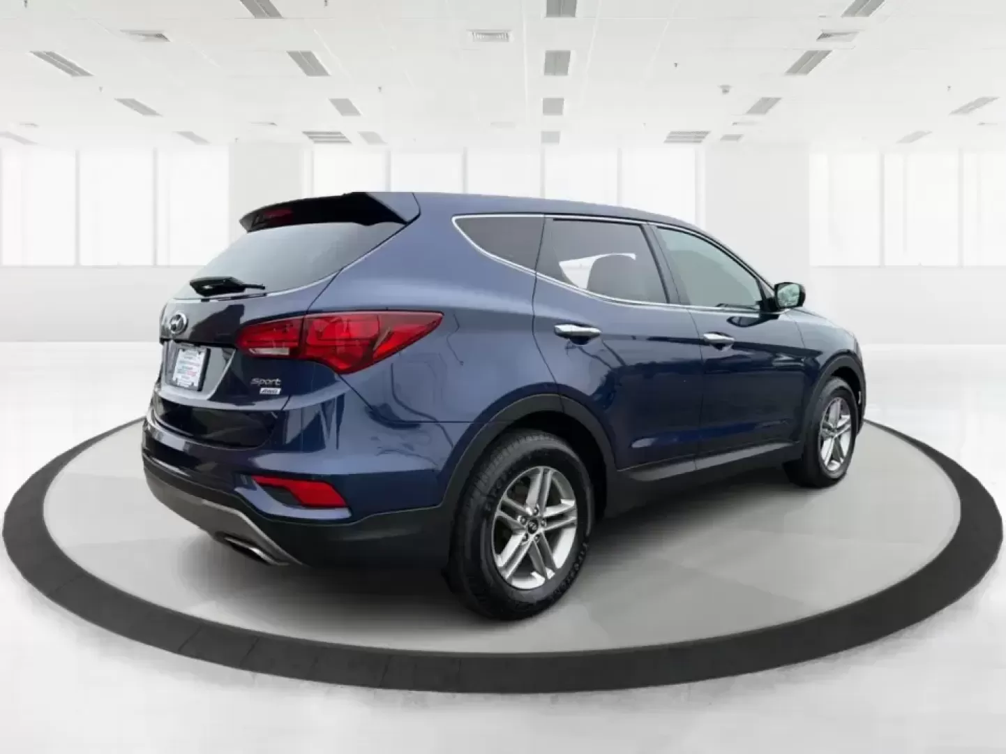 2018 Hyundai Santa Fe 2.4L (5XYZTDLB6JG) with an Theta II 2.4L I-4 gasoline direct injection engine, 6A transmission, located at 8750 N County Rd 25A, Piqua, OH, 45356, (937) 908-9800, 40.164391, -84.232513 - Road trips to Indian Lake, snowy school runs, and everyday commuting up and down I75 feel a lot easier when your SUV is roomy, confident in bad weather, and comfortable for everyone on board. This 2018 Hyundai Santa Fe 2.4L in striking Nightfall Blue is a practical, family-friendly sport utility tha - Photo#2