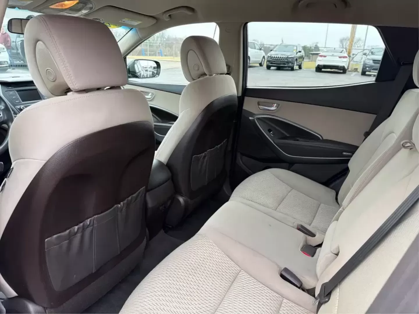 2018 Hyundai Santa Fe 2.4L (5XYZTDLB6JG) with an Theta II 2.4L I-4 gasoline direct injection engine, 6A transmission, located at 8750 N County Rd 25A, Piqua, OH, 45356, (937) 908-9800, 40.164391, -84.232513 - Road trips to Indian Lake, snowy school runs, and everyday commuting up and down I75 feel a lot easier when your SUV is roomy, confident in bad weather, and comfortable for everyone on board. This 2018 Hyundai Santa Fe 2.4L in striking Nightfall Blue is a practical, family-friendly sport utility tha - Photo#10