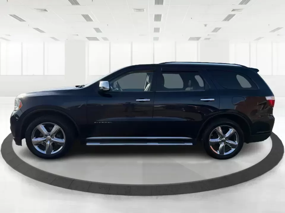 2013 Dodge Durango Citadel (1C4SDJET6DC) with an 5.7L V8 OHV 16V engine, 5-Speed Automatic transmission, located at 8750 N County Rd 25A, Piqua, OH, 45356, (937) 908-9800, 40.164391, -84.232513 - Need one SUV that can handle school drop-offs, I-75 commutes, and a loaded-up weekend trip to Indian Lake or a tailgate in Dayton-without giving up comfort or capability? This 2013 Dodge Durango Citadel in True Blue Pearlcoat is built for real-life Ohio driving, with confident 4WD/AWD traction, V8 p - Photo#5