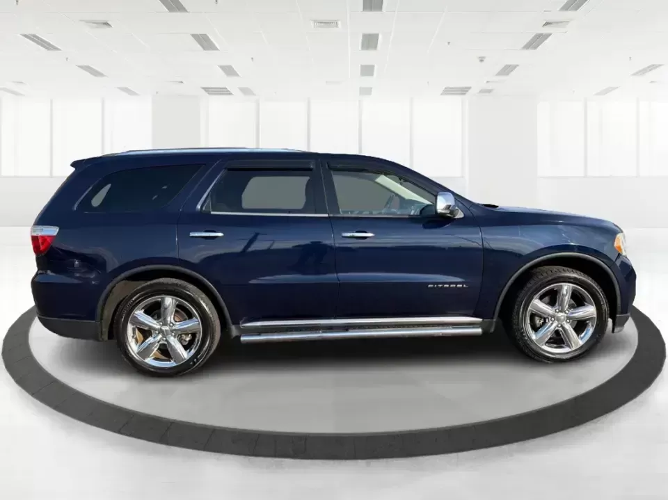 2013 Dodge Durango Citadel (1C4SDJET6DC) with an 5.7L V8 OHV 16V engine, 5-Speed Automatic transmission, located at 1951 S Dayton Lakeview Rd., New Carlisle, OH, 45344, (937) 908-9800, 39.890999, -84.050255 - Need one SUV that can handle school drop-offs, I-75 commutes, and a loaded-up weekend trip to Indian Lake or a tailgate in Dayton-without giving up comfort or capability? This 2013 Dodge Durango Citadel in True Blue Pearlcoat is built for real-life Ohio driving, with confident 4WD/AWD traction, V8 p - Photo#1