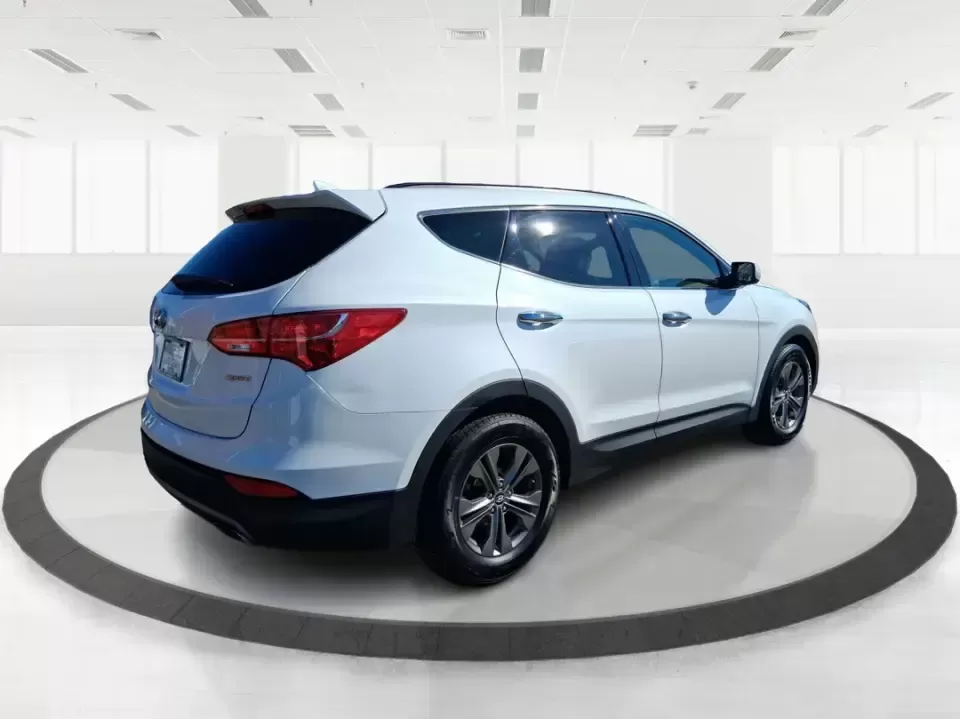 2013 Hyundai Santa Fe Sport (5XYZU3LB7DG) with an Theta II 2.4L I-4 gasoline direct injection engine, 6-Speed Automatic transmission, located at 880 E. National Road, Vandalia, OH, 45377, (937) 908-9800, 39.891918, -84.183594 - Need one SUV that can handle school drop-offs, I75 commutes, and a weekend escape to Taylorsville MetroPark without draining your budget? This 2013 Hyundai Santa Fe Sport is a smart, road-trip-ready crossover that blends everyday practicality with comfort features you'll appreciate on longer drives - Photo#2