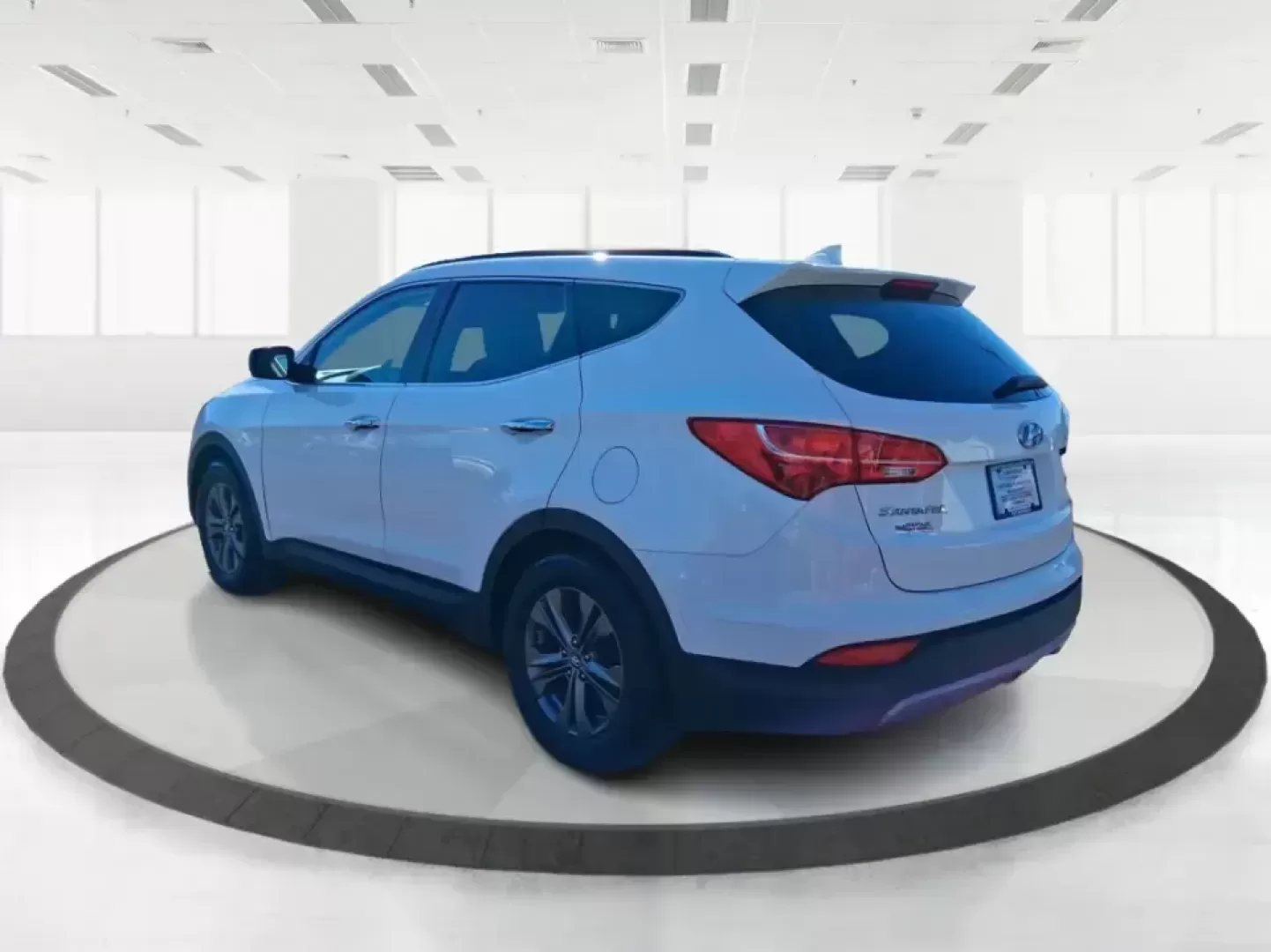 2013 Hyundai Santa Fe Sport (5XYZU3LB7DG) with an Theta II 2.4L I-4 gasoline direct injection engine, 6-Speed Automatic transmission, located at 1951 S Dayton Lakeview Rd., New Carlisle, OH, 45344, (937) 908-9800, 39.890999, -84.050255 - Need one SUV that can handle school drop-offs, I75 commutes, and a weekend escape to Taylorsville MetroPark without draining your budget? This 2013 Hyundai Santa Fe Sport is a smart, road-trip-ready crossover that blends everyday practicality with comfort features you'll appreciate on longer drives - Photo#4
