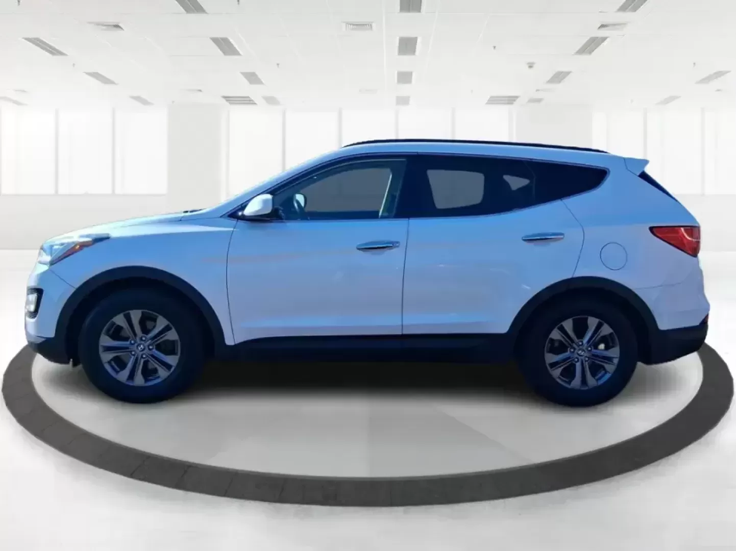 2013 Hyundai Santa Fe Sport (5XYZU3LB7DG) with an Theta II 2.4L I-4 gasoline direct injection engine, 6-Speed Automatic transmission, located at 1951 S Dayton Lakeview Rd., New Carlisle, OH, 45344, (937) 908-9800, 39.890999, -84.050255 - Need one SUV that can handle school drop-offs, I75 commutes, and a weekend escape to Taylorsville MetroPark without draining your budget? This 2013 Hyundai Santa Fe Sport is a smart, road-trip-ready crossover that blends everyday practicality with comfort features you'll appreciate on longer drives - Photo#5