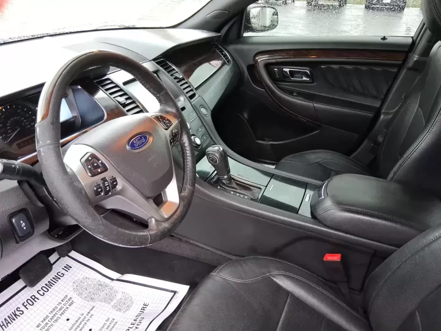 2014 Ford Taurus Limited FWD (1FAHP2F80EG) with an 3.5L V6 DOHC 24V engine, 6-Speed Automatic transmission, located at 8750 N County Rd 25A, Piqua, OH, 45356, (937) 908-9800, 40.164391, -84.232513 - Need a comfortable, confidence-inspiring sedan for a daily commute between Piqua and Dayton, school drop-offs, or weekend getaways up I-75? This 2014 Ford Taurus Limited FWD delivers the kind of quiet, upscale ride that makes long drives feel shorter-while still keeping practicality front and center - Photo#9