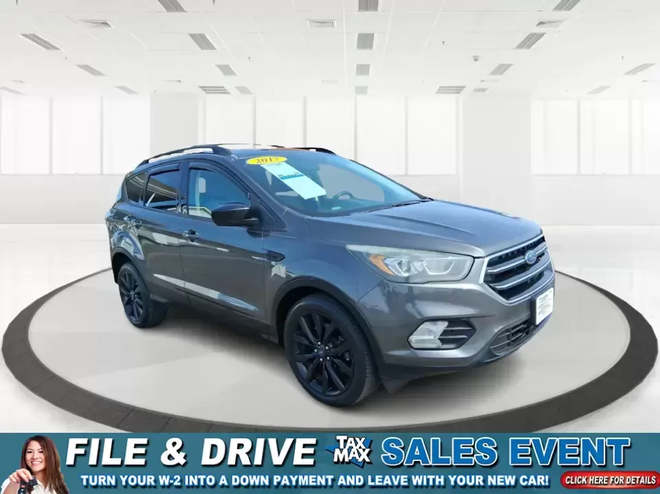 2017 Ford Escape SE (1FMCU9GD2HU) with an 1.5L L4 DOHC 16V engine, 6A transmission, located at 880 E. National Road, Vandalia, OH, 45377, (937) 908-9800, 39.891918, -84.183594 - Make every day easier-whether you're tackling a long commute up I-75, shuttling kids between school and practice, or packing up for a weekend escape to the Dayton area parks. This 2017 Ford Escape SE in Magnetic Metallic is the kind of compact SUV that fits real life in Vandalia, OH: easy to park, c - Photo#0