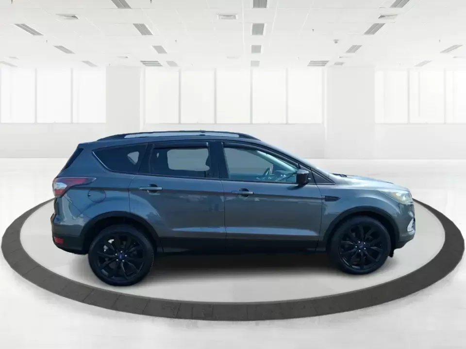 2017 Ford Escape SE (1FMCU9GD2HU) with an 1.5L L4 DOHC 16V engine, 6A transmission, located at 880 E. National Road, Vandalia, OH, 45377, (937) 908-9800, 39.891918, -84.183594 - Make every day easier-whether you're tackling a long commute up I-75, shuttling kids between school and practice, or packing up for a weekend escape to the Dayton area parks. This 2017 Ford Escape SE in Magnetic Metallic is the kind of compact SUV that fits real life in Vandalia, OH: easy to park, c - Photo#1